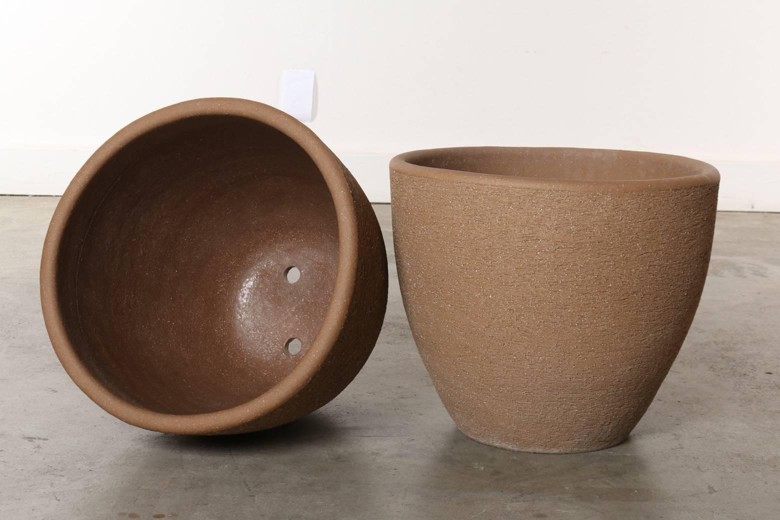 These original large scale Stan Bitters ceramic scrape pots have a presence that embodies the California landscape and an essence that artfully complements the plants they hold. Hand-built and organic, these pots conjure up images of the master