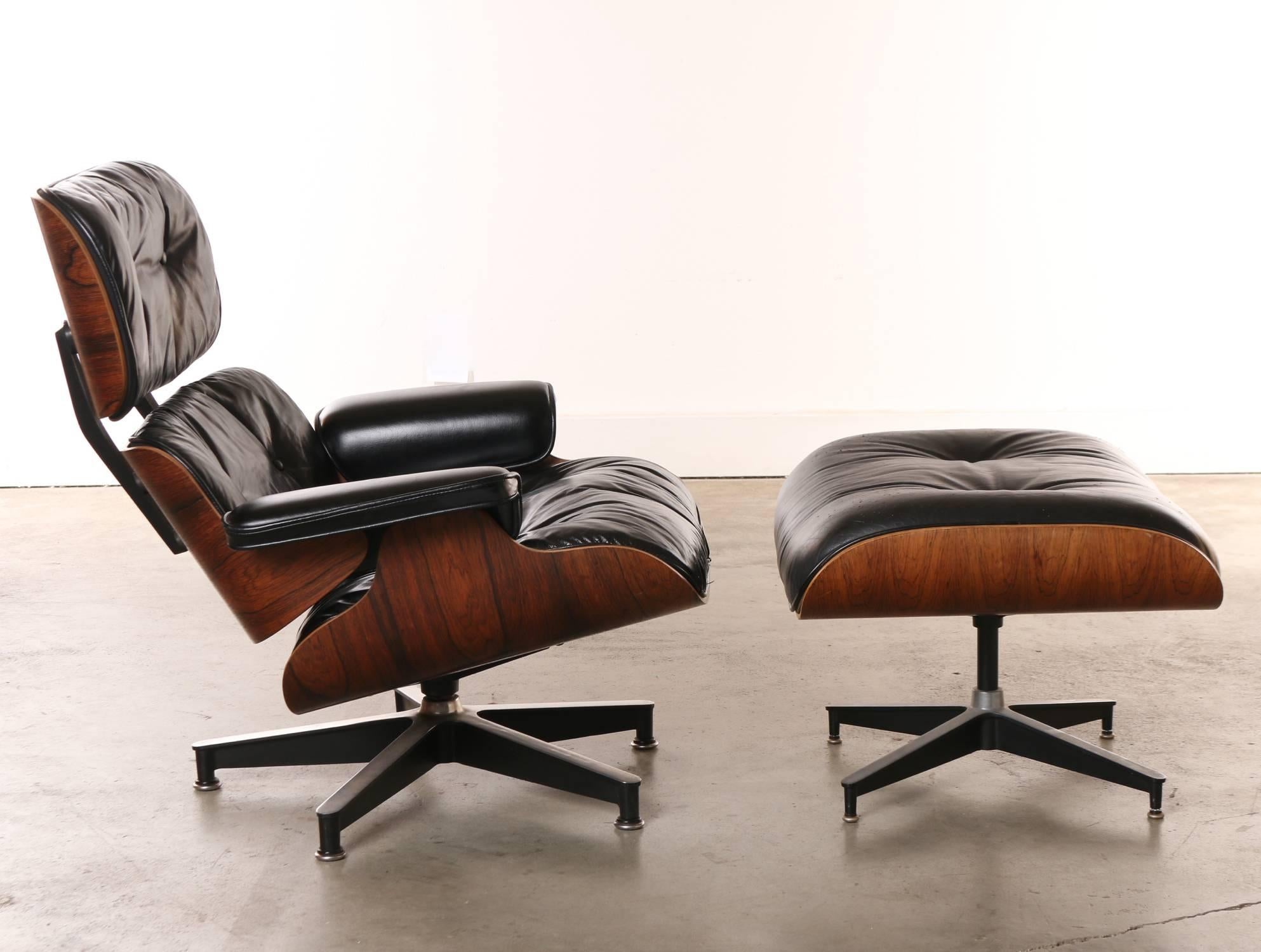 Highly sought after rosewood 670 lounge chair and 671 Ottoman designed by Charles and Ray Eames in 1956 for Herman Miller. The lounge chair has a Herman Miller manufacturer's label on underside that reads: 