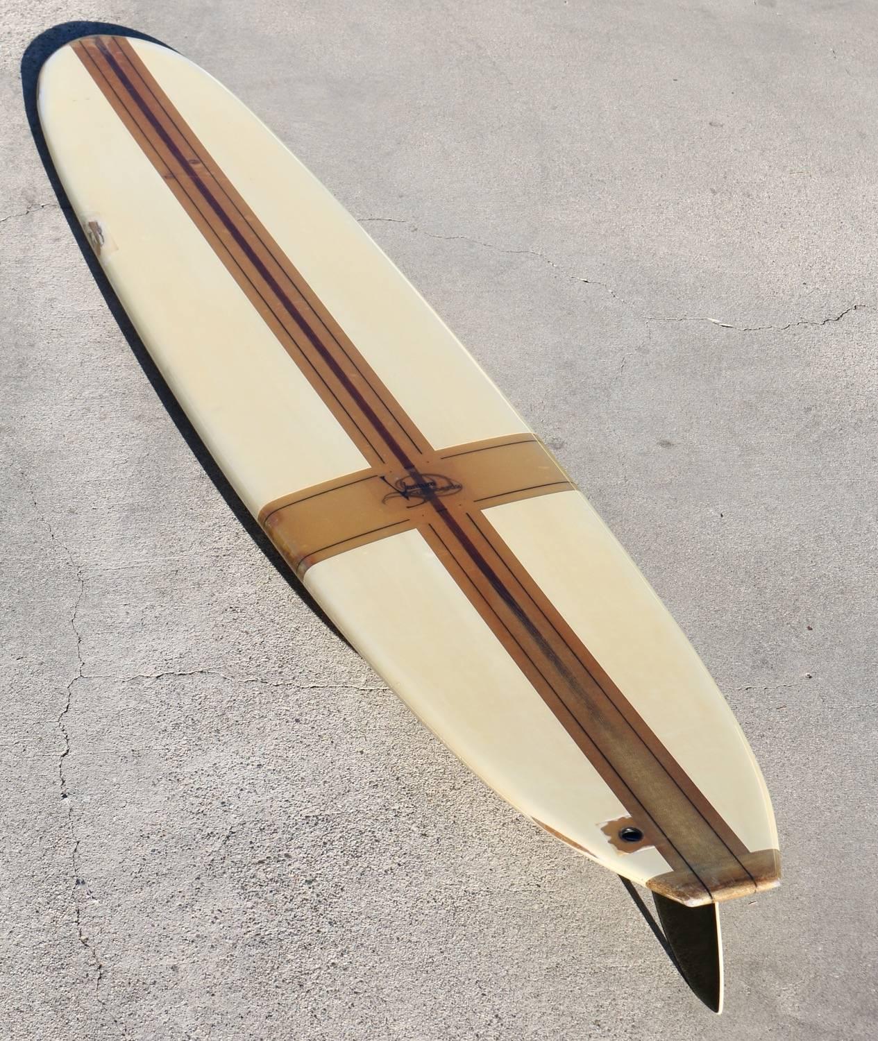 Attractive 1960s longboard in good condition with fabulous patina and old-school style.
A few dings, scrapes and paint chips but nothing that detracts from its overall beauty.

Surfing Cowboys® is recognized as the go-to source for California