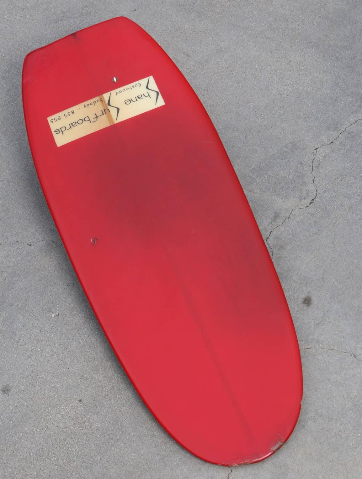 Beautiful and rare Shane Surfboards, Paipo or Belly-Board, circa 1965. Manufactured by Shane Steadman from his shop in Eastwood Sydney. 

This board is bright red with a 1/2