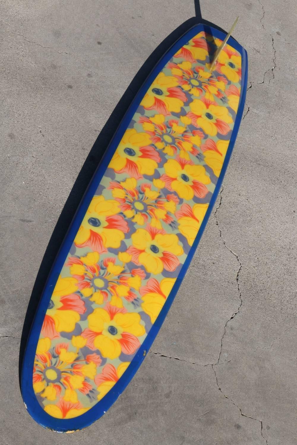 This all original surfboard offers 2 completely different floral patterns, one on the deck (top) and another on the bottom.  A riot of color from either side. Wonderful to rotate and display depending on your mood or the environment.
Made circa
