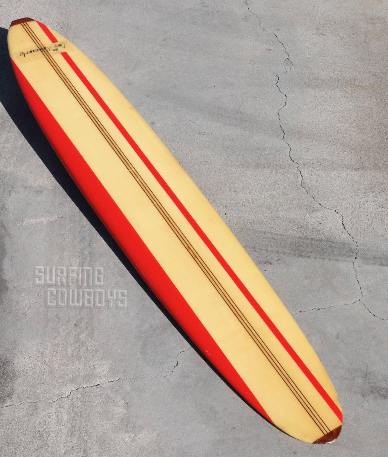 This classic longboard is a throwback to the Beach Boys era and captures a slice of times gone by. Perfect to prop in a corner, hang on a wall or sit atop a Woody Station Wagon headed to the beach. The red stripe and rail, three redwood stringers,