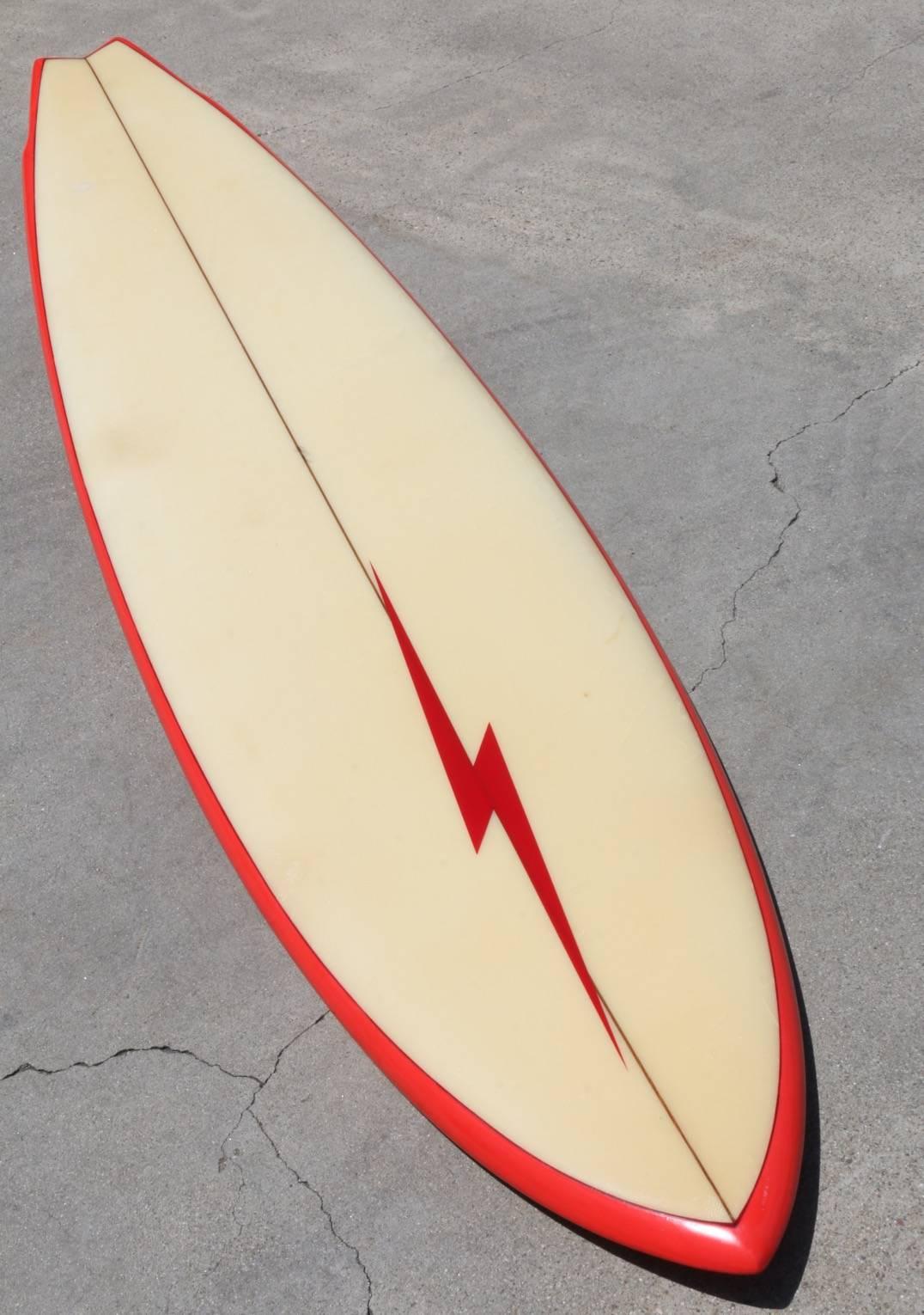 During the 1970s Lightning Bolt was shaped under license in California
by Hobie Surfboards in Dana Point, CA. Their master shaper was Terry
Martin, this is a Terry Martin shaped board! It's a classic board with
a big wave gun shape and