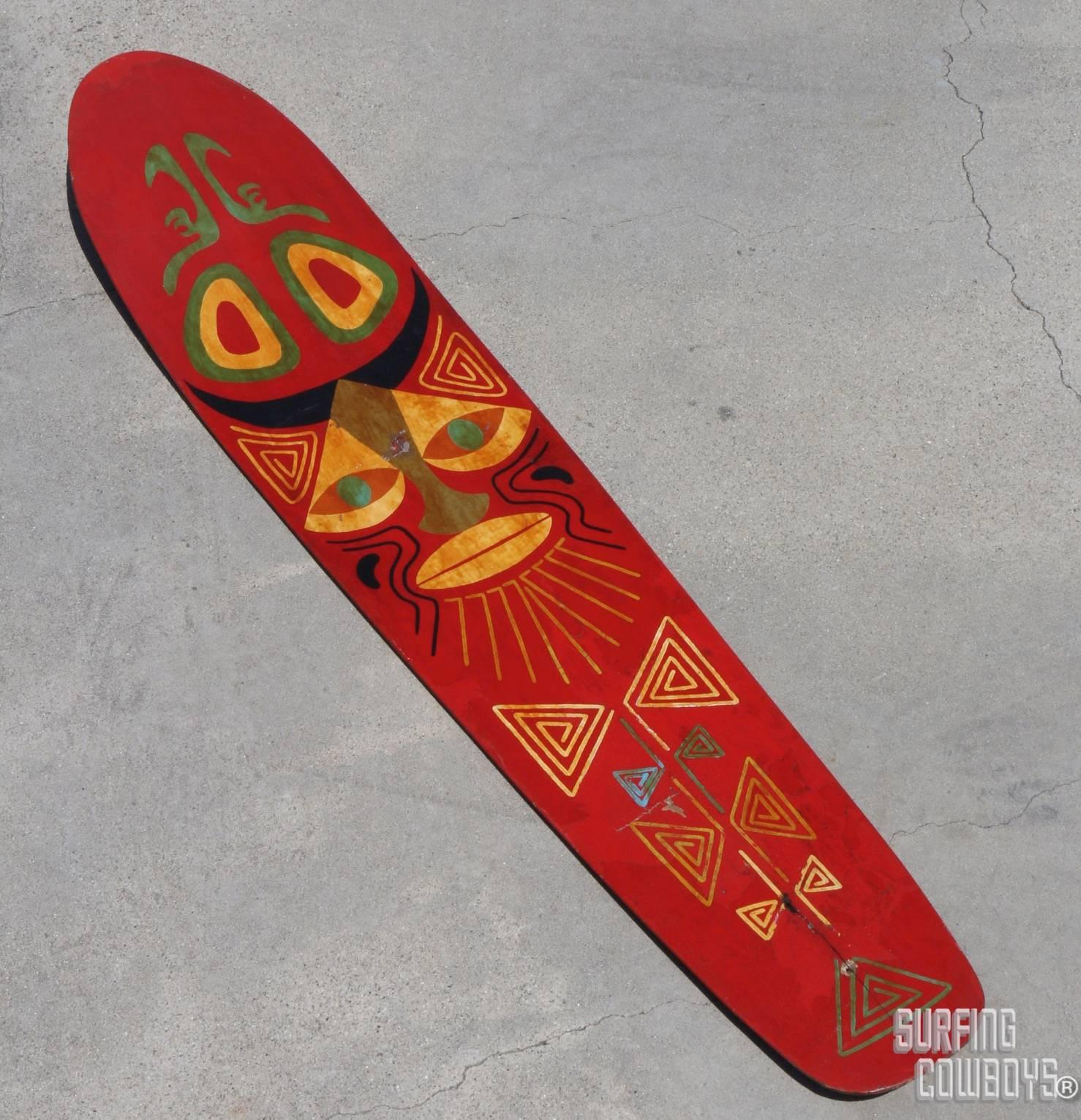 This hand painted bentwood surfboard is one of the most beautiful boards that we have had the privilege to own and sell. Made circa 1920s of two pieces of thin wood that were glued, laminated together, then steamed.  The nose has, what was at its