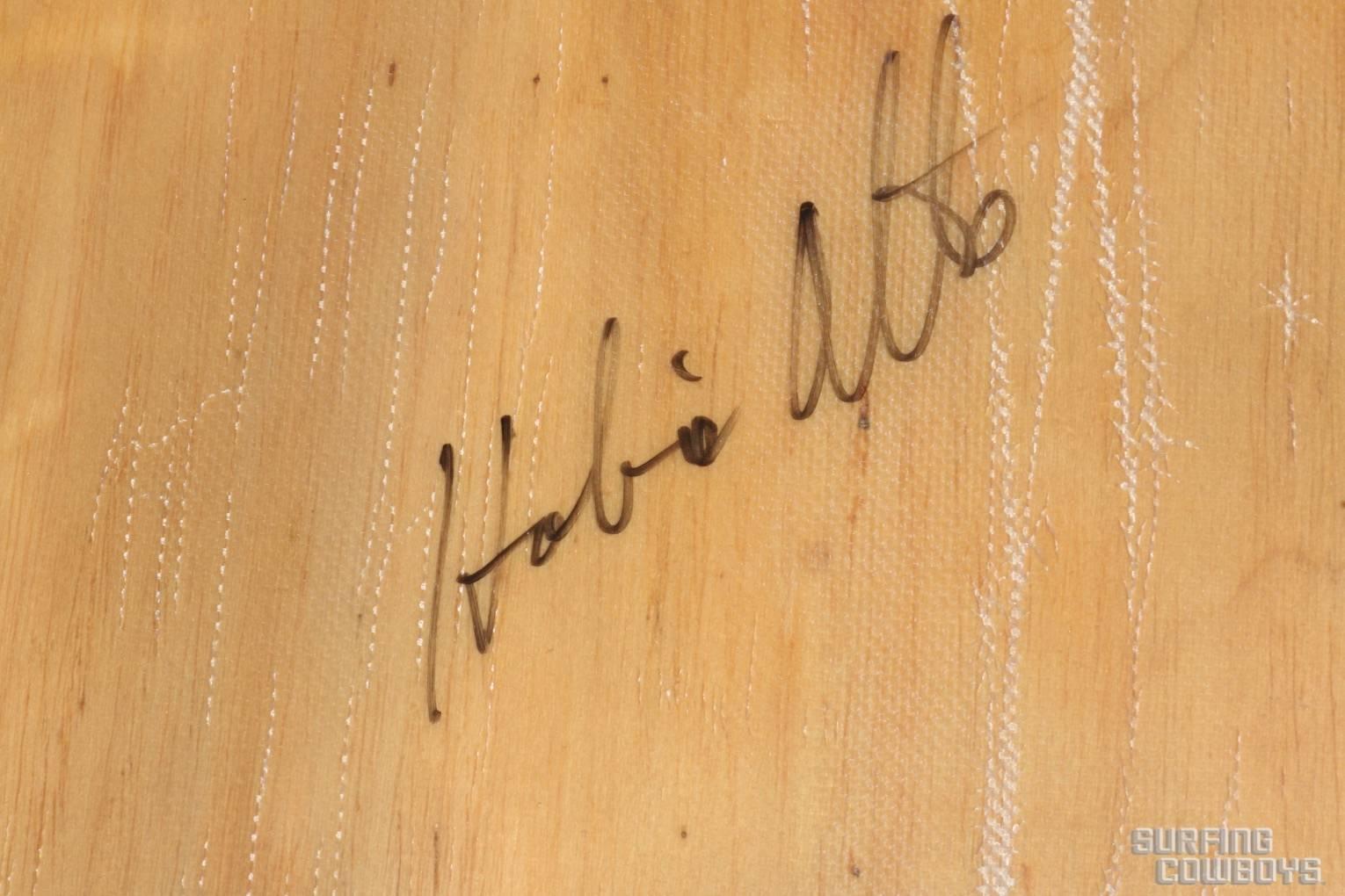 Balsa Wood Surfboard, Circa 1950, All Original, Signed Hobie Alter
This is a board with presence.  Made of solid balsa wood with fiberglass and resin wrap that makes it hard and gives it shape. 

Hobie signed this board about 8 years ago, at an