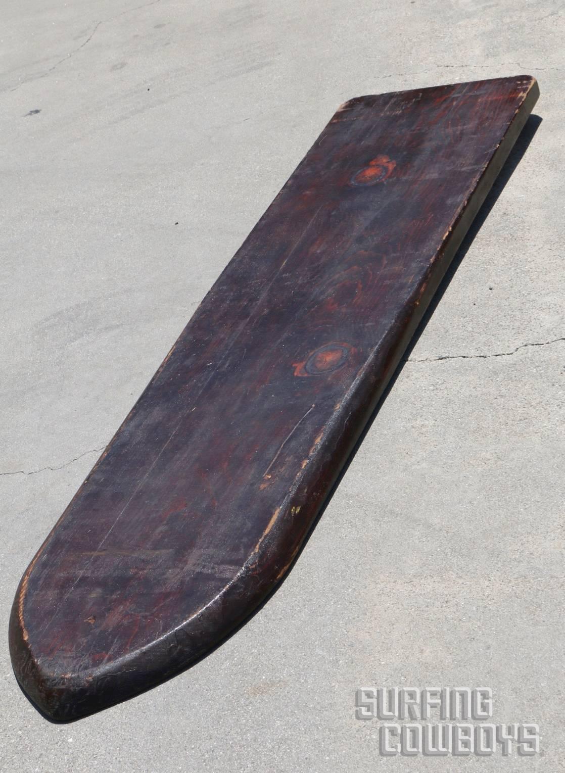 Solid Wood Surfboard, circa 1920s, Hand Shaped, All Original  
This beautiful solid wood surfboard is from the the 1920s. The board was hand shaped with a hard top rail and rounded lower rails that would have allowed for smooth turning. The nose