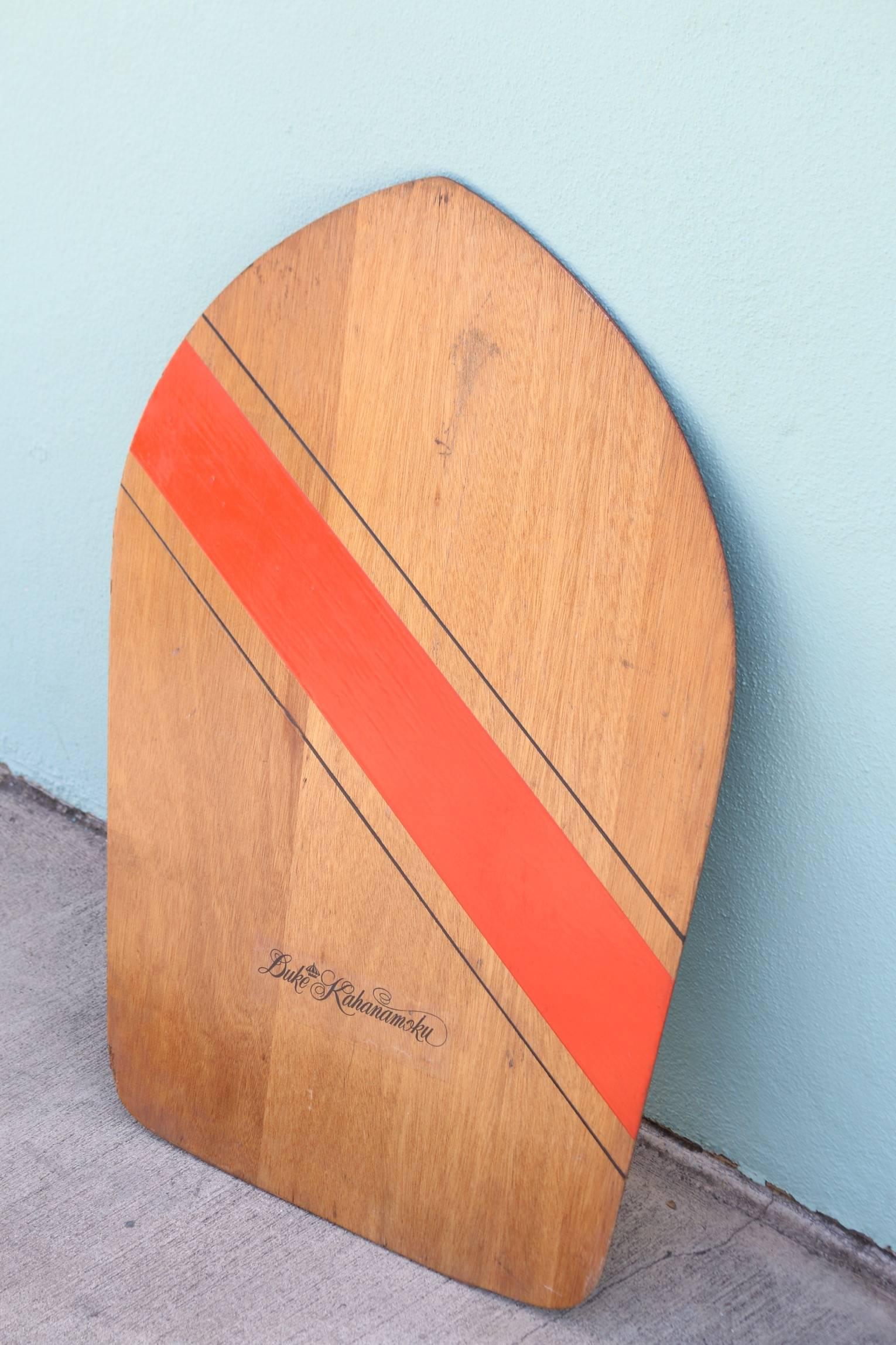 Duke Kahanamoku Skimboard, Wood, circa 1960s, Original  
In amazing original vintage condition, this Duke skimboard is one of the rarest of the Duke Kahanamoku Collectibles and a winner for collectors and decorators alike. This is the first of