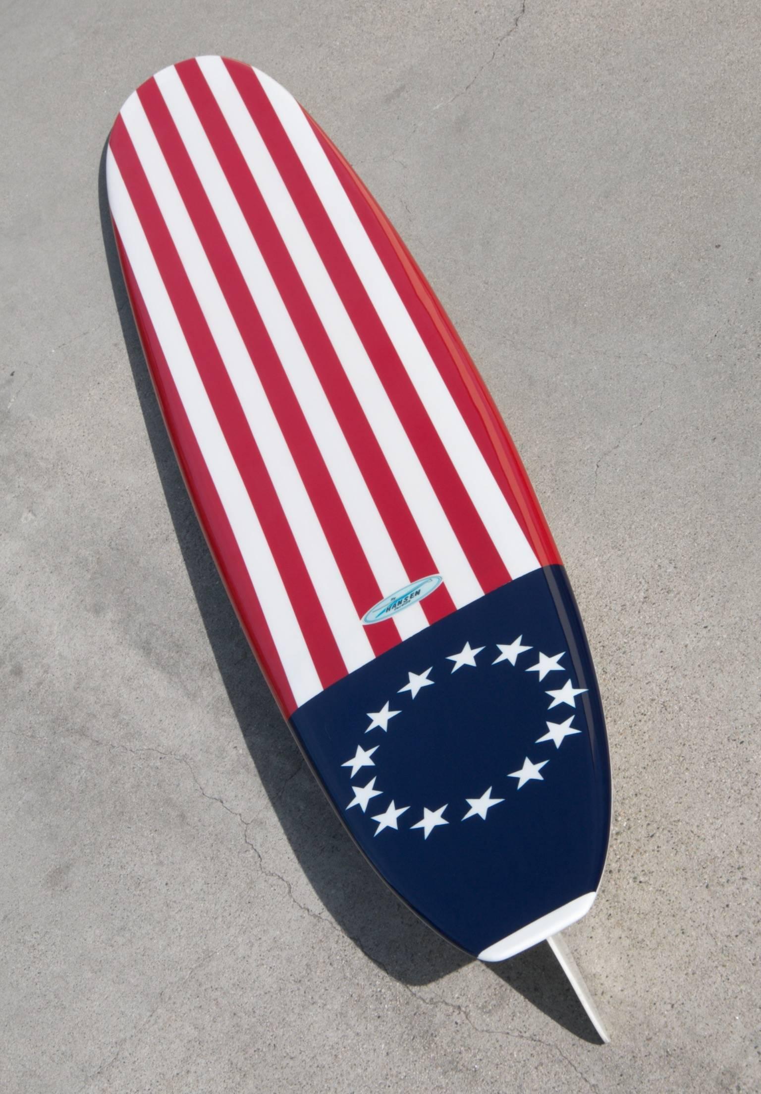 This rare Hanson Surfboard with American Navy Flag motif was made circa 1962. It has been fully restored and re-pigmented to its original glory. Patriotic, stylish and a celebration of freedom in the surf.  Expert art work based on the original US