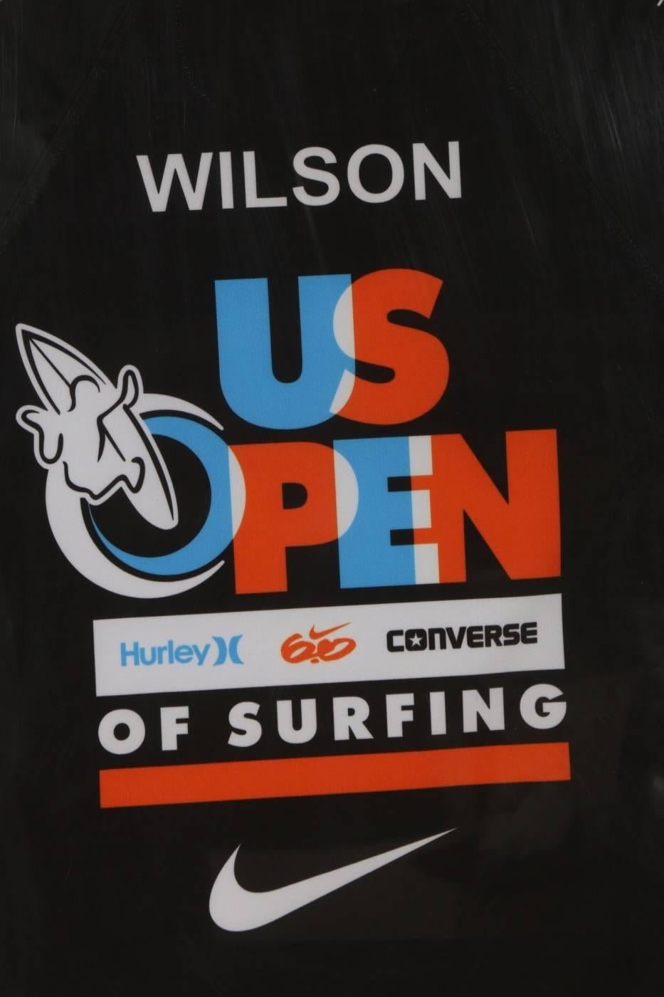 Julian Wilson US Open Surf Competition team Rash Guard Jersey.
Promotional rash guard jersey made by Nike for Julian Wilson, US Open of Surfing, Wilson was the 1st place winner of this competition in 2012. 

Only a couple of these garments were ever