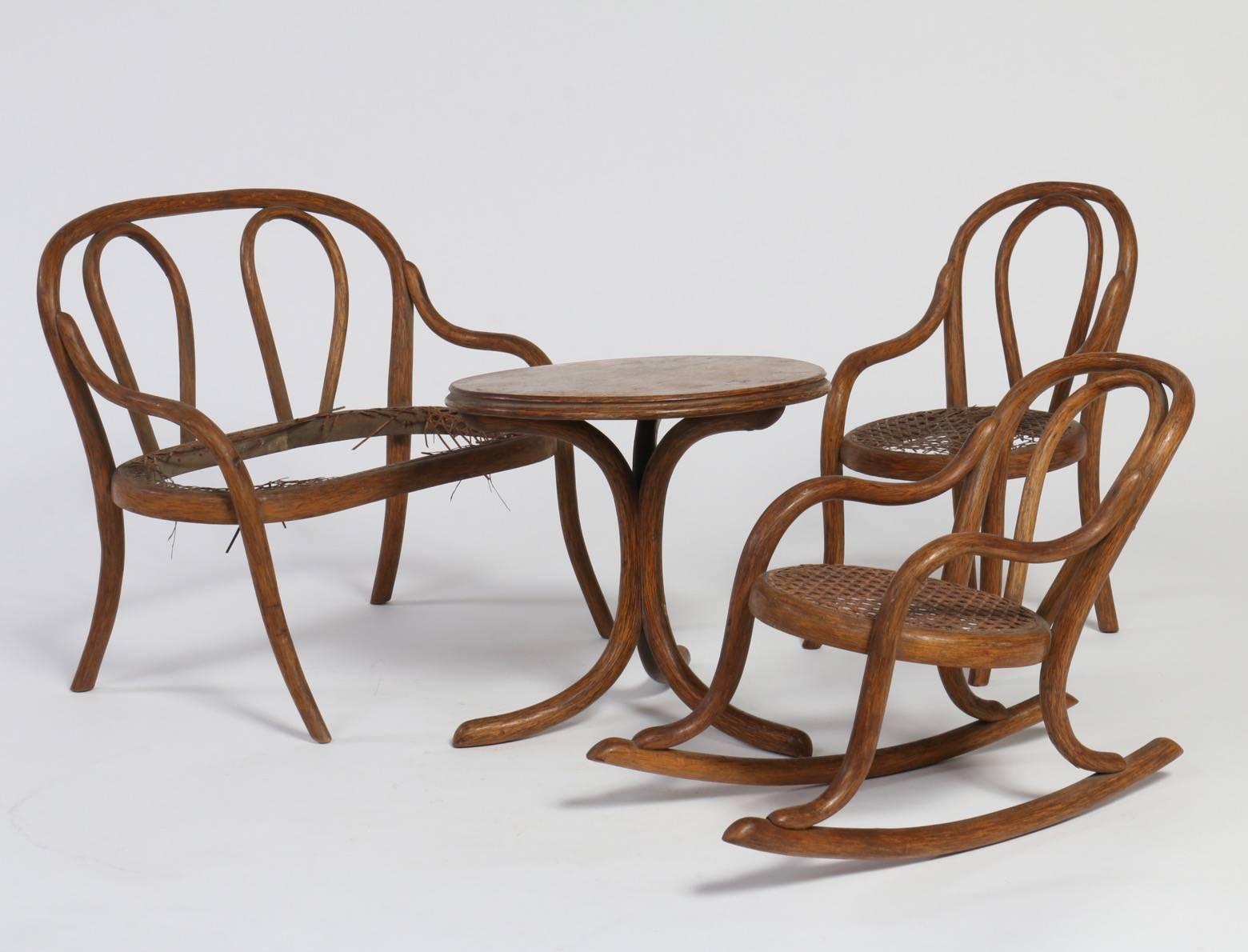 This is a rare set of doll furniture made by Thonet, the master of bentwood furniture and creator of the iconic bentwood chairs that altered the direction of furniture design. We estimate the manufacture date to be circa 1875. This four piece set is
