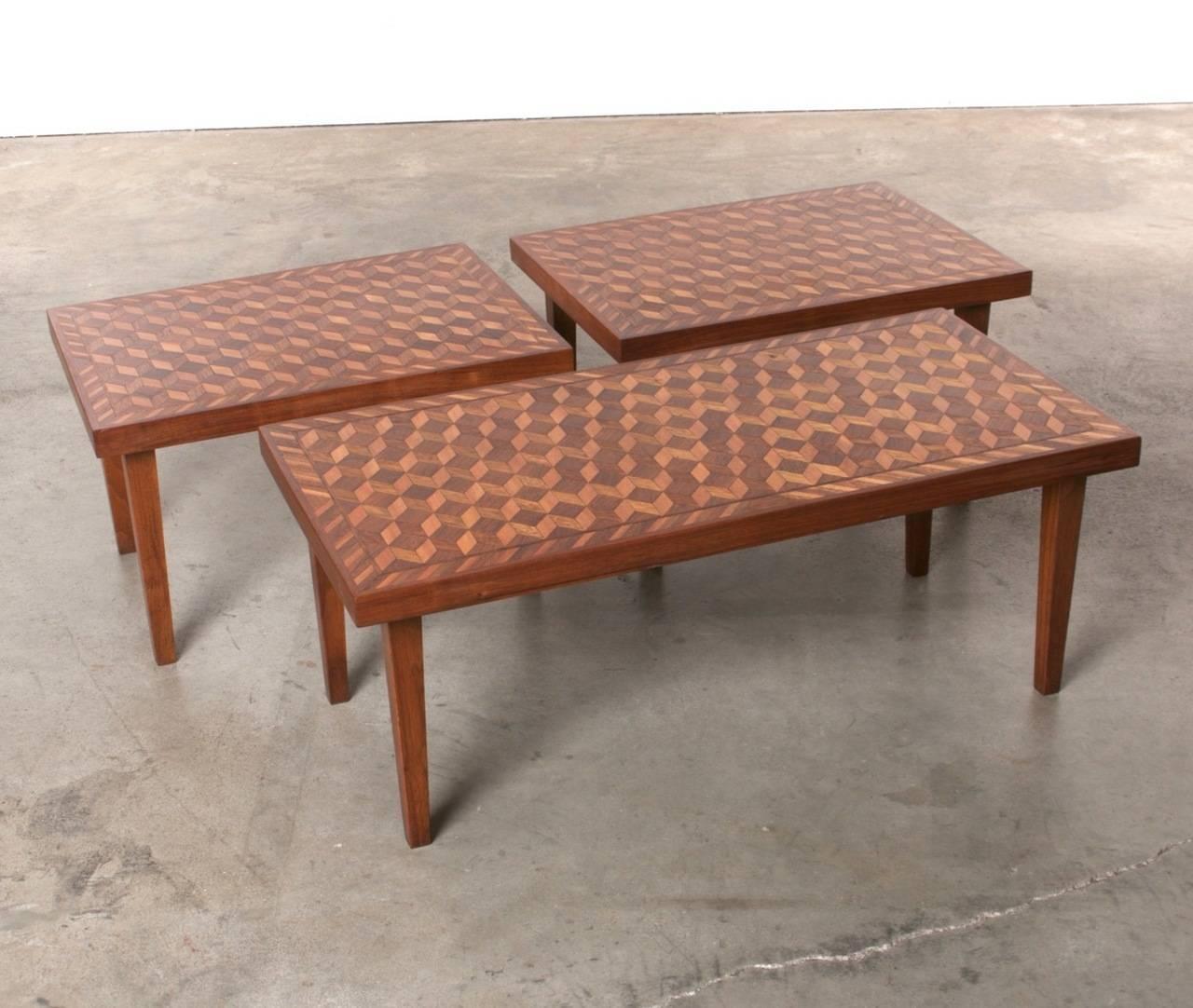 Handmade Geometric coffee table and side table set in the style of M. C. Escher. Three different woods, hand-cut marquetry, meticulous attention to detail. Angular legs taper to the floor offering sturdy support. Escher's trademark optical illusions