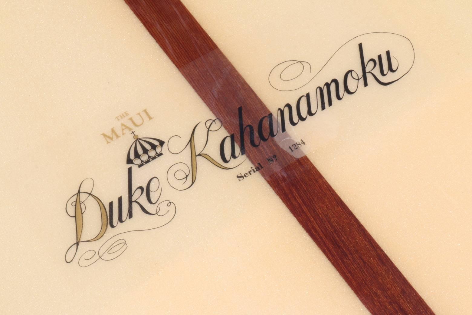 It is remarkable that this beautiful early 1960s Duke Kahanamoku surfboard has survived for 50+ years and remains in such excellent condition. The fiberglass
has very few blemishes, the foam is bright and clear, the logo vibrant
and the nose and