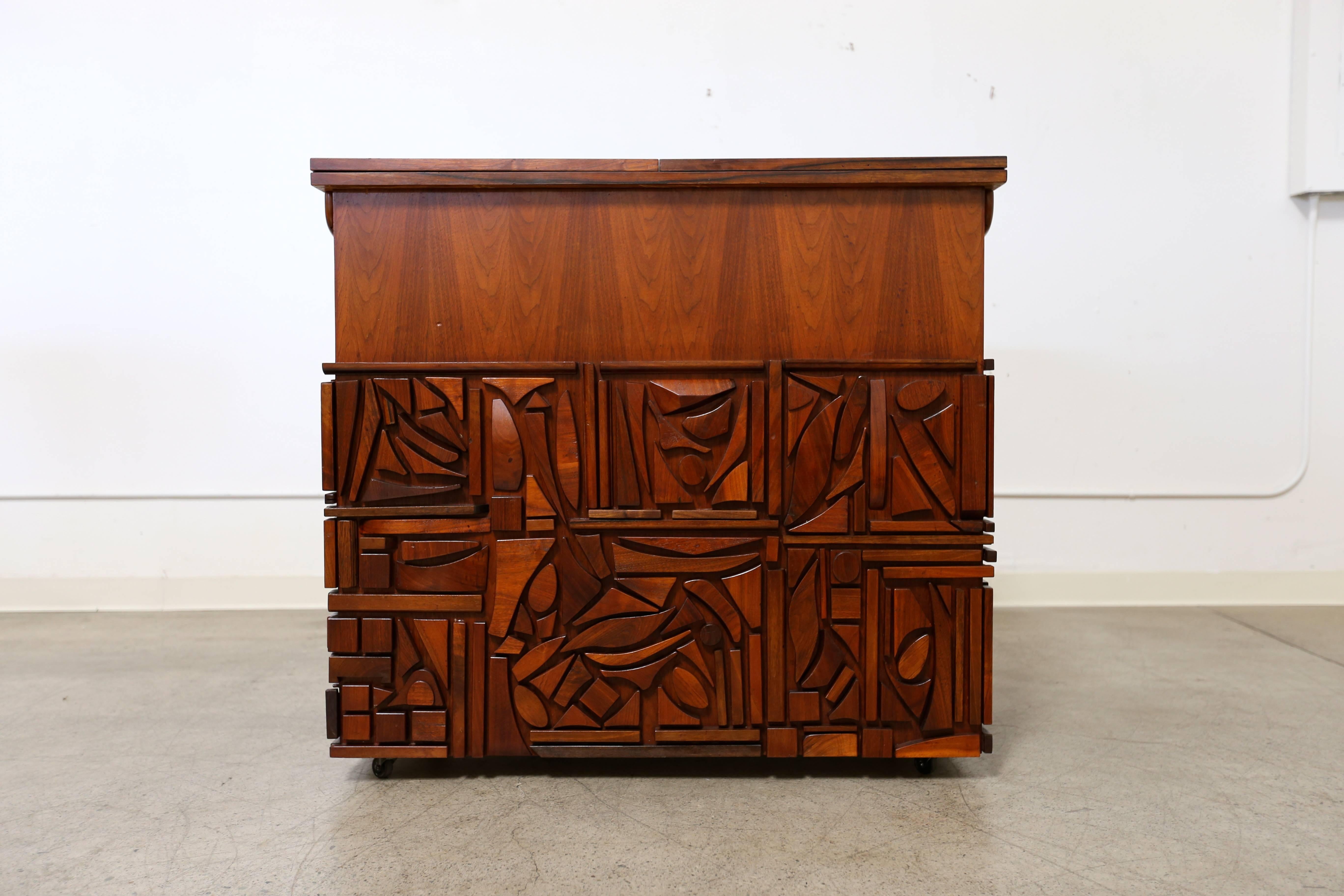 Studio crafted bar cabinet by California artist Mabel Hutchinson. This is the only known example to exist. The original owner acquired this piece directly from the artist. This piece measures 86