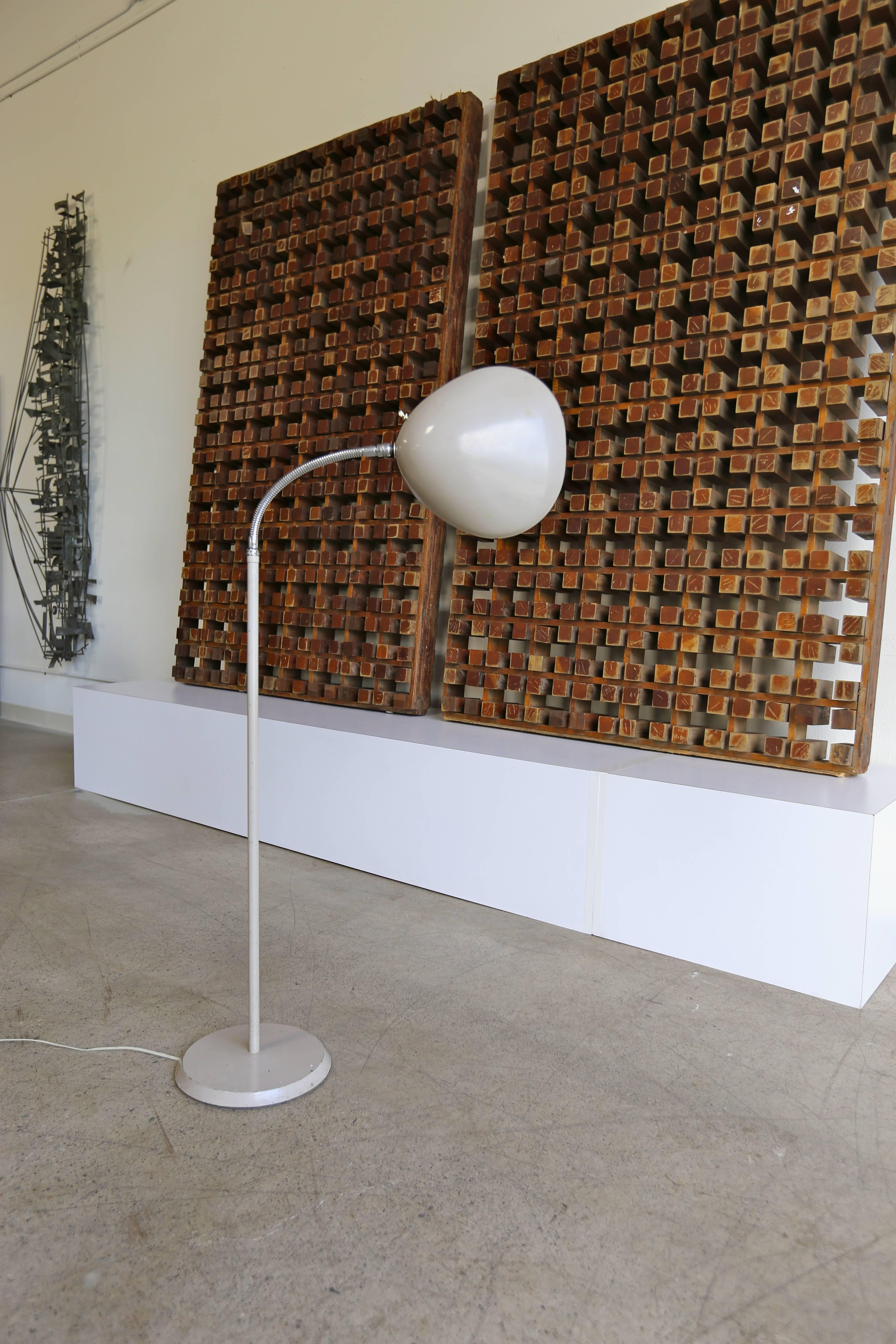 Cobra floor lamp by Greta Magnusson Grossman. This piece was manufactured by Ralph O. Smith. Retains the original paint.