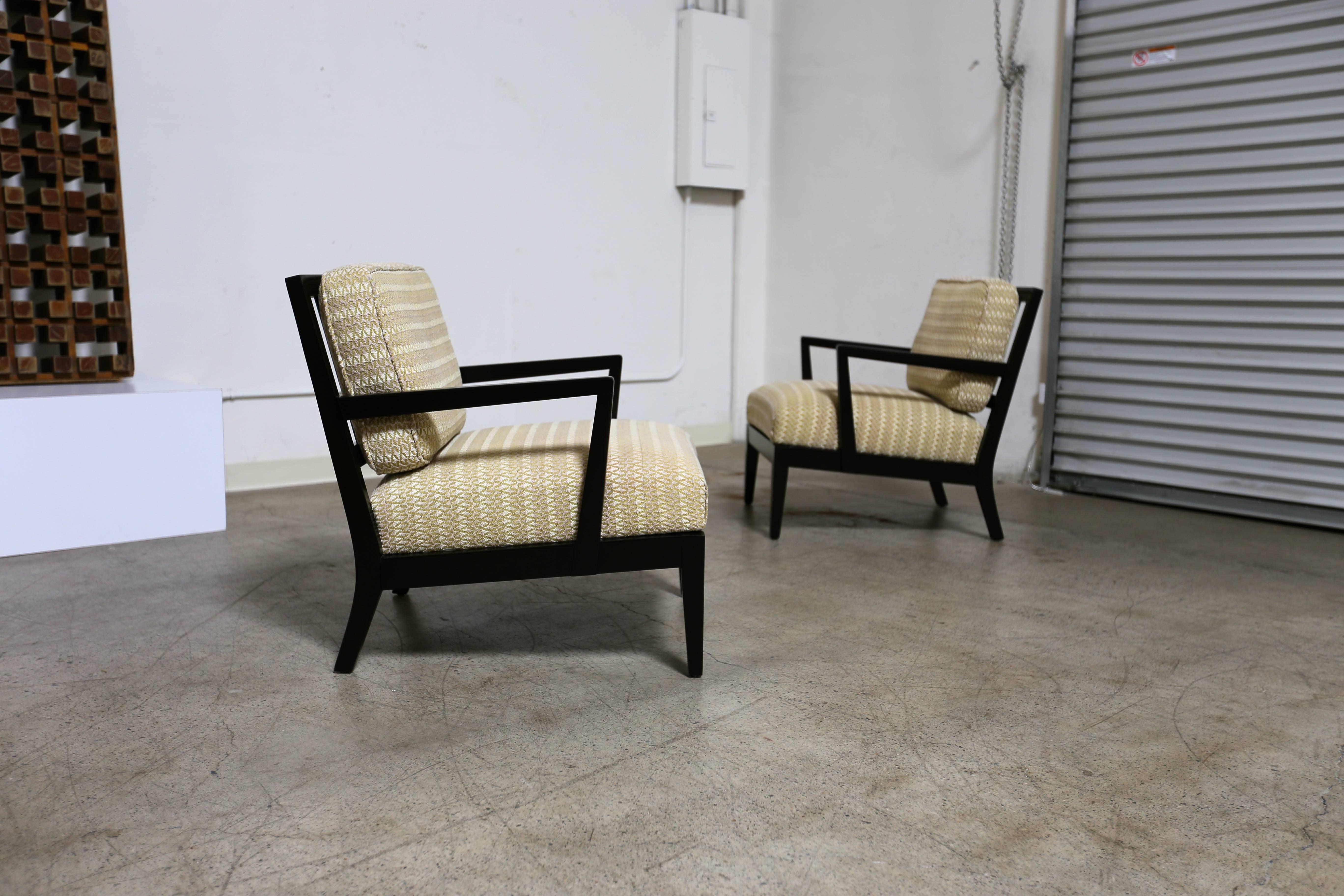 Pair of Classic ebonized lounge chairs.