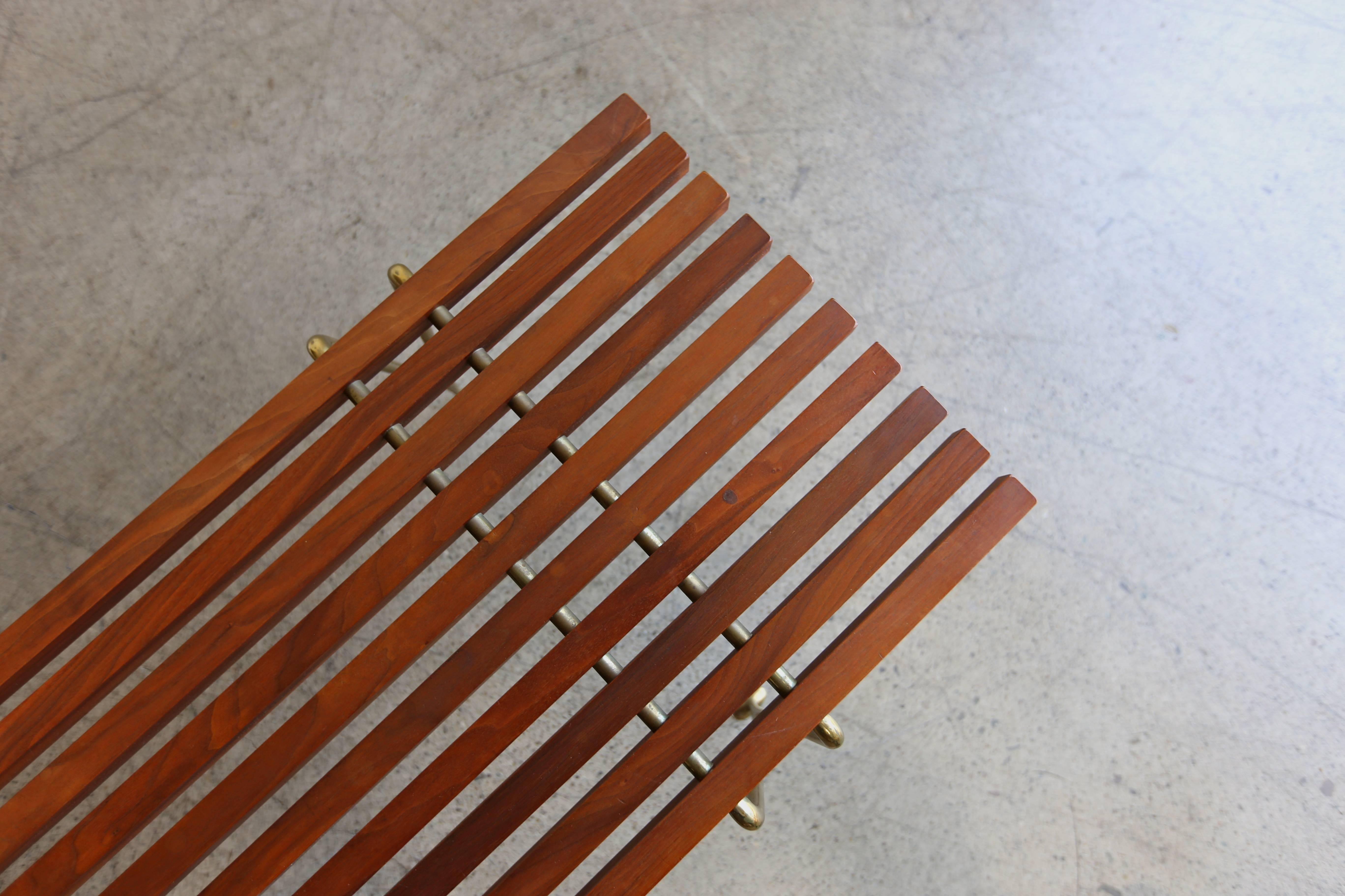 Walnut and brass slat bench or coffee table by Hugh Acton.