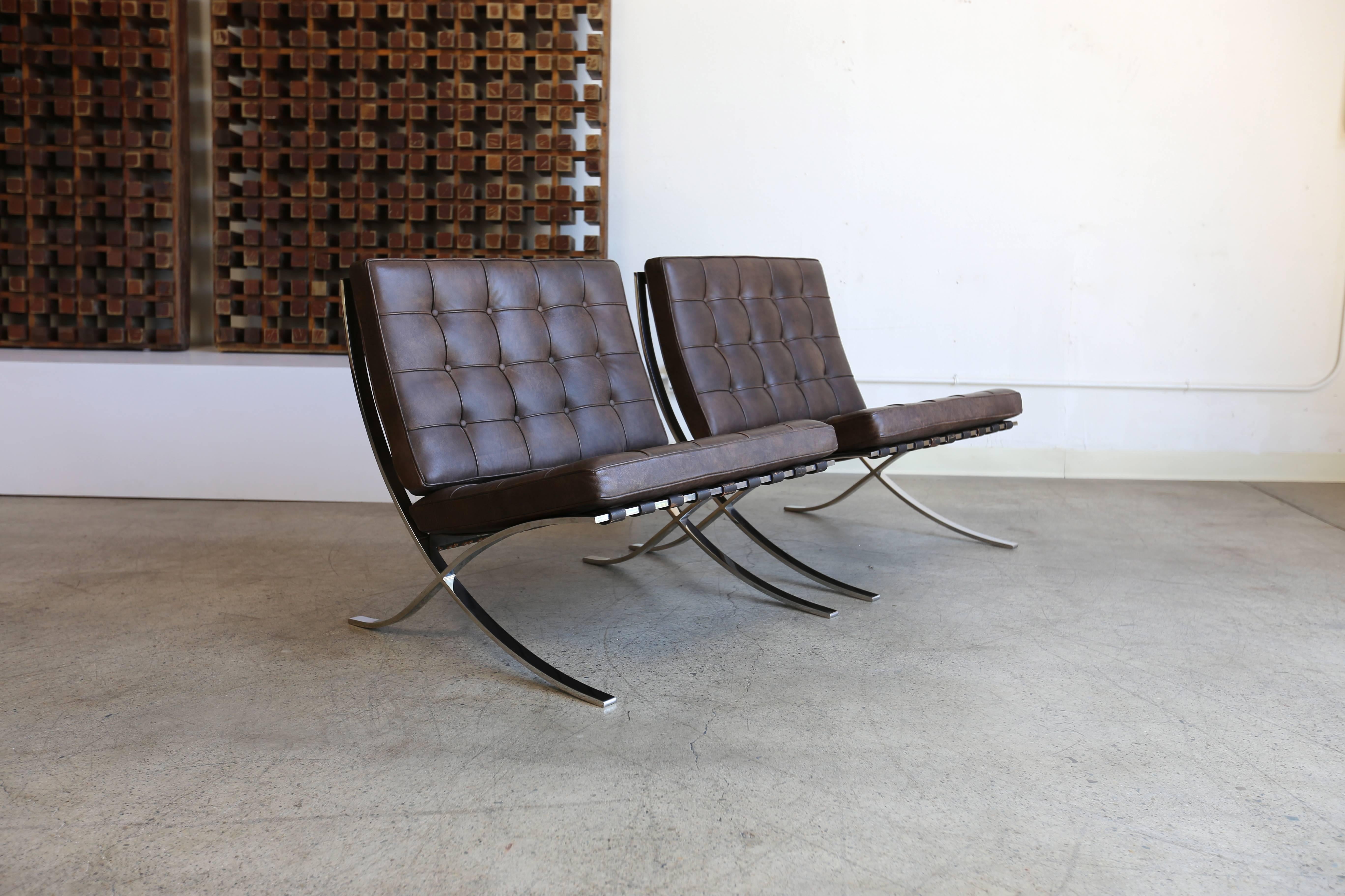 Pair of Barcelona chairs by Ludwig Mies van der Rohe for Gerald R. Griffith. Each example is hand signed. 