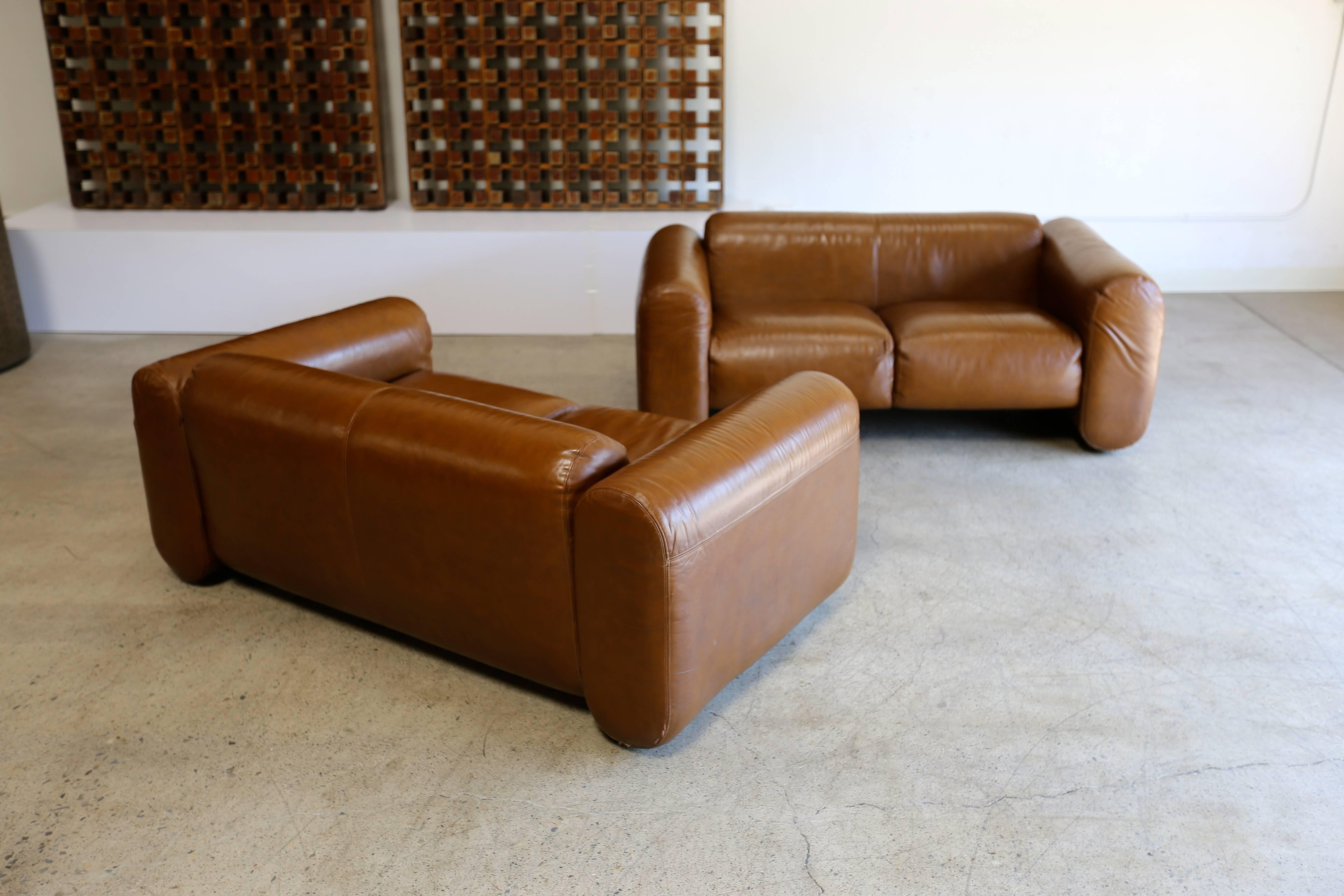 Pair of leather sofas by Stendig.
