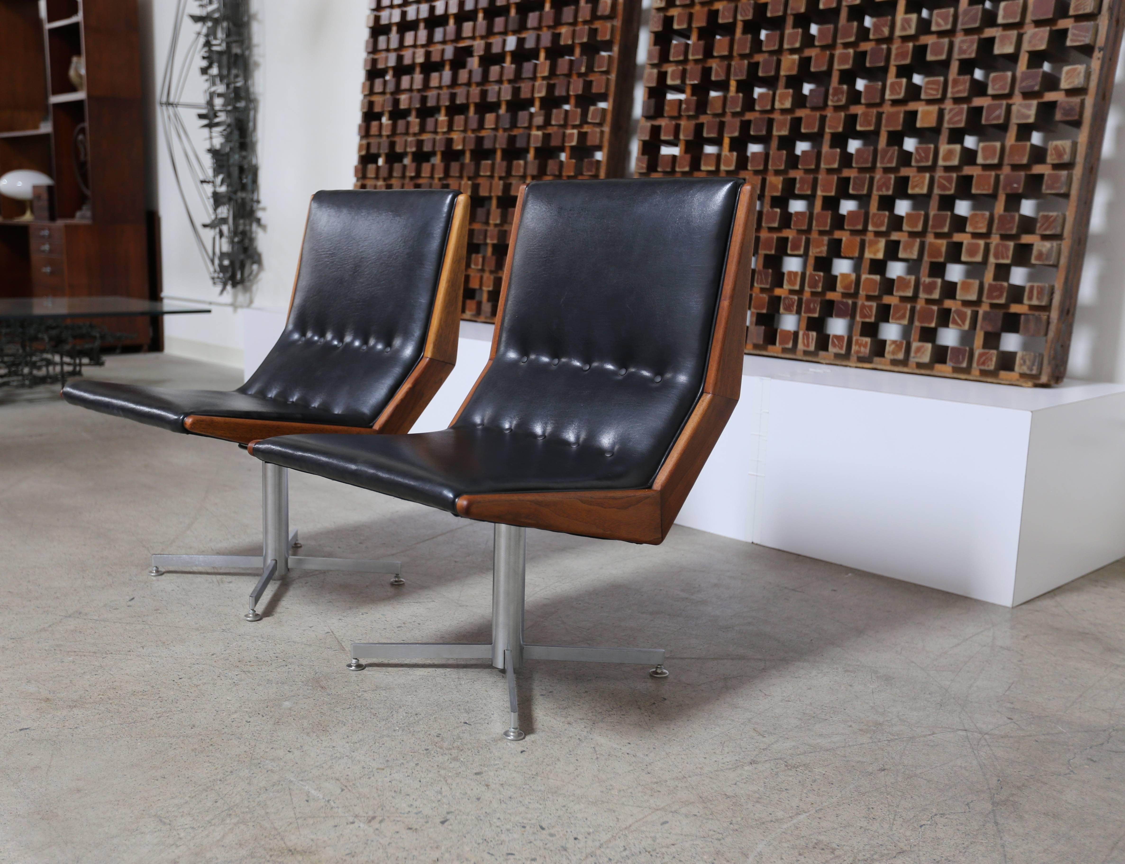 Pair of modernist walnut framed swivel chairs. (Two pairs available).