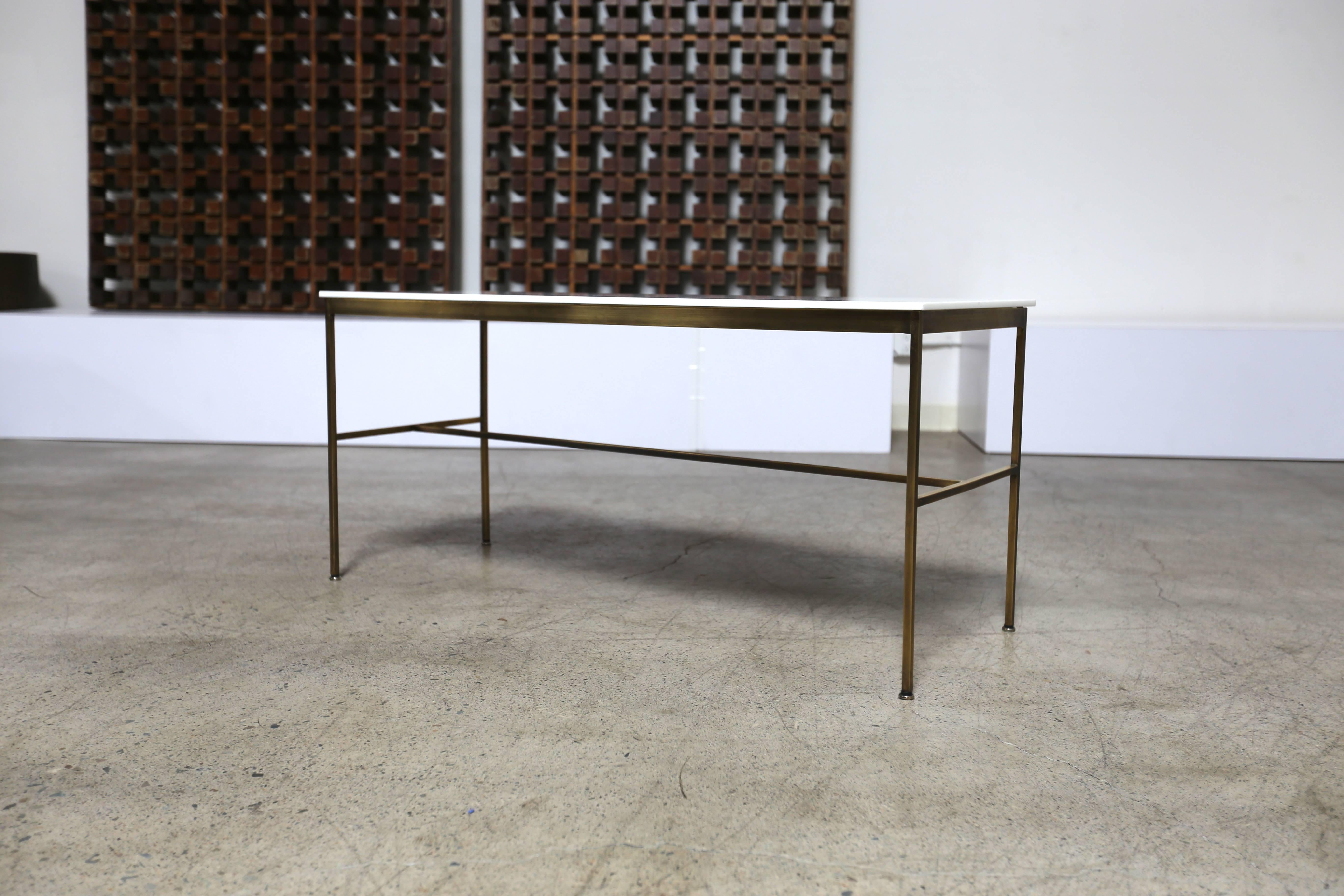 Brass and vitrolite / milk glass console table by Paul McCobb.