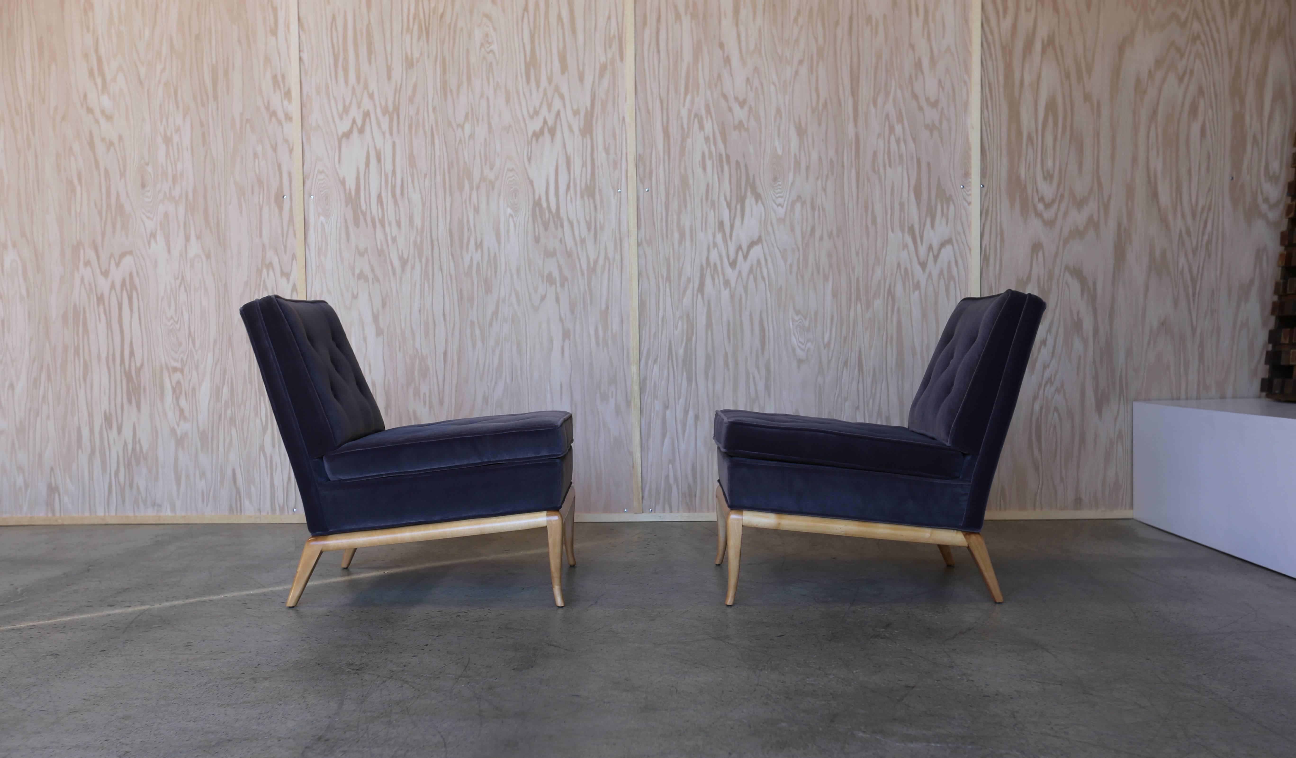Pair of Slipper Lounge Chairs by T.H. Robsjohn Gibbings. This pair has been upholstered in a charcoal velvet.