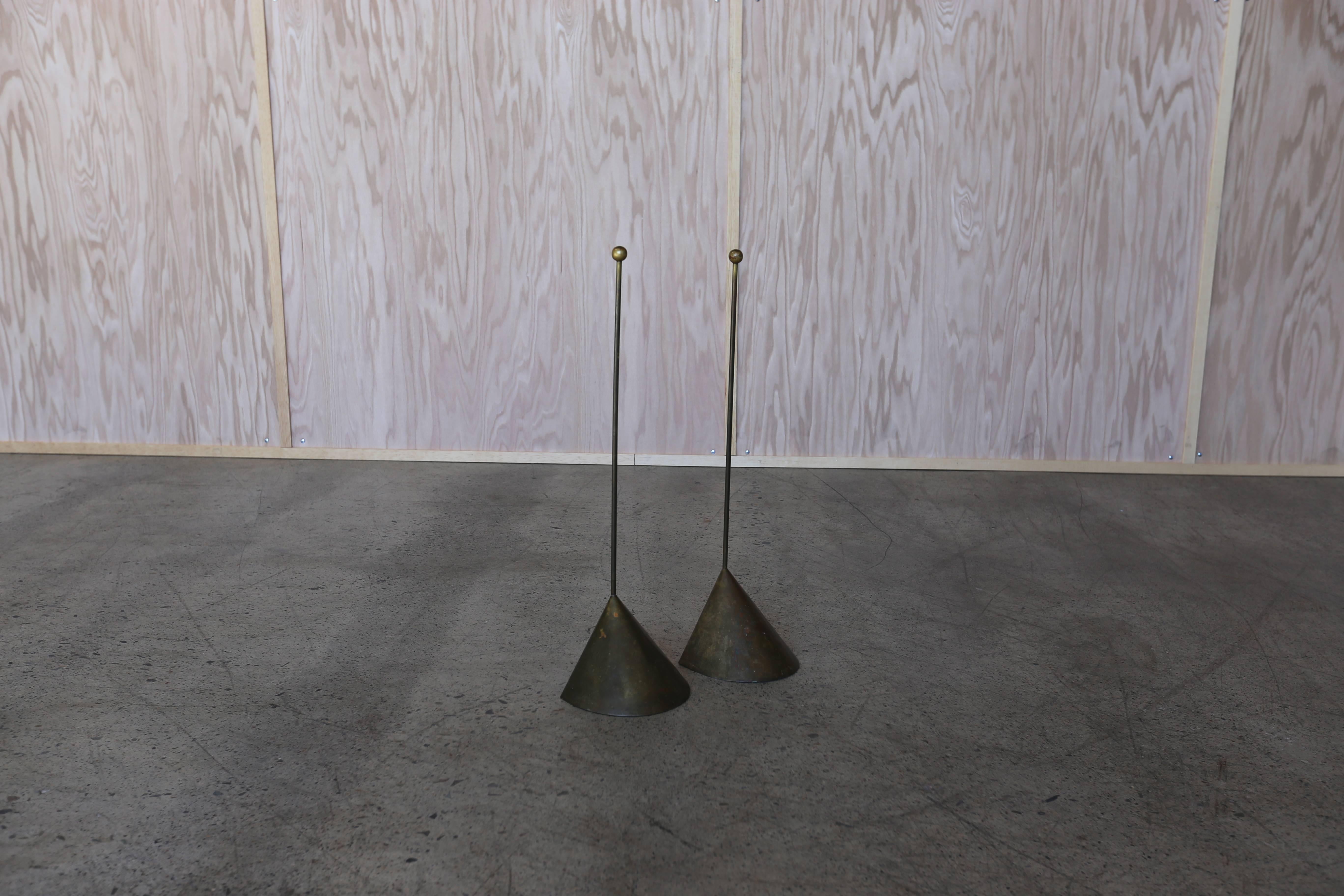 Pair of modernist brass doorstops with a great original patina.

One measures: 6