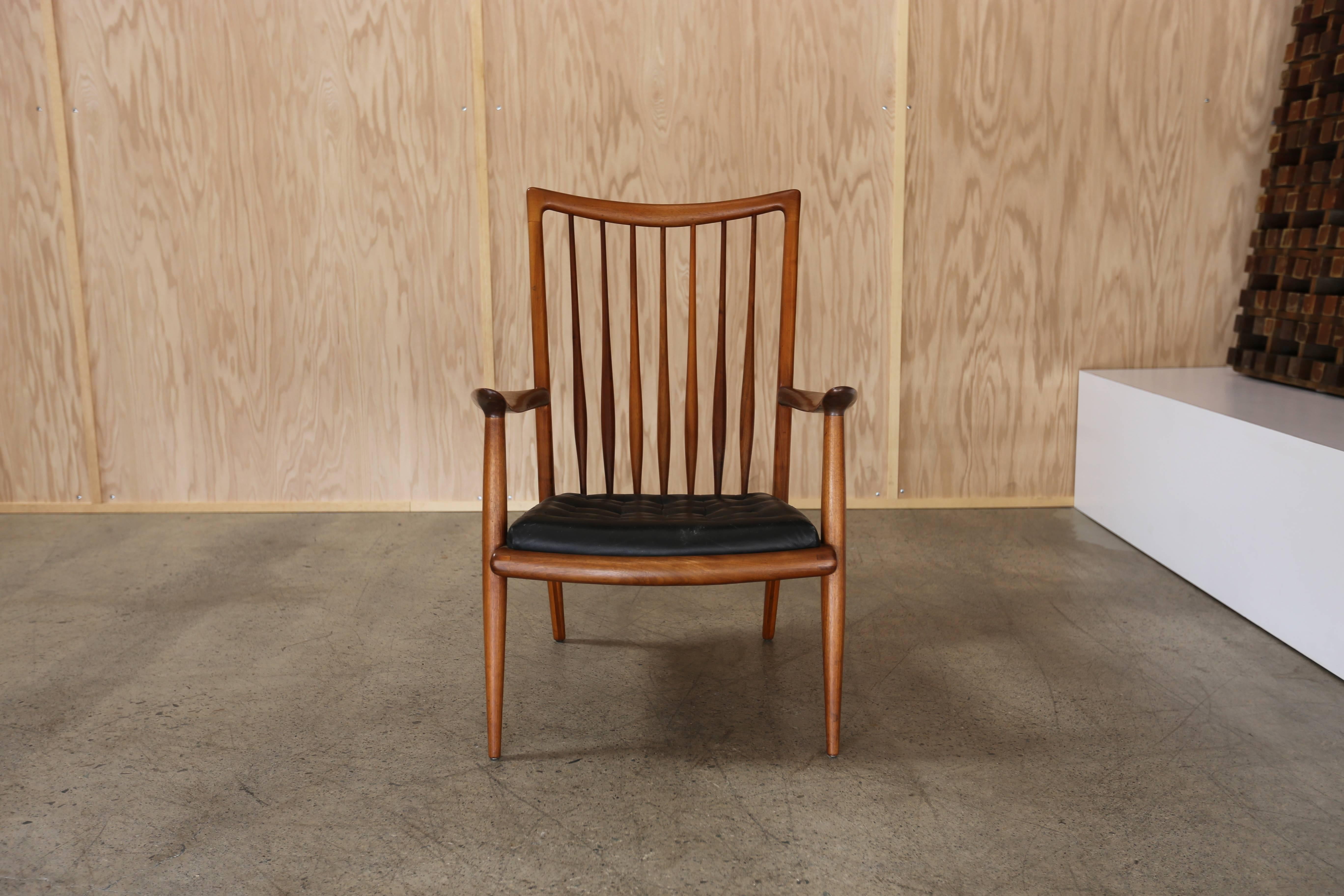 Handcrafted lounge chair by California modern woodworker Sam Maloof. This piece is branded to the bottom.