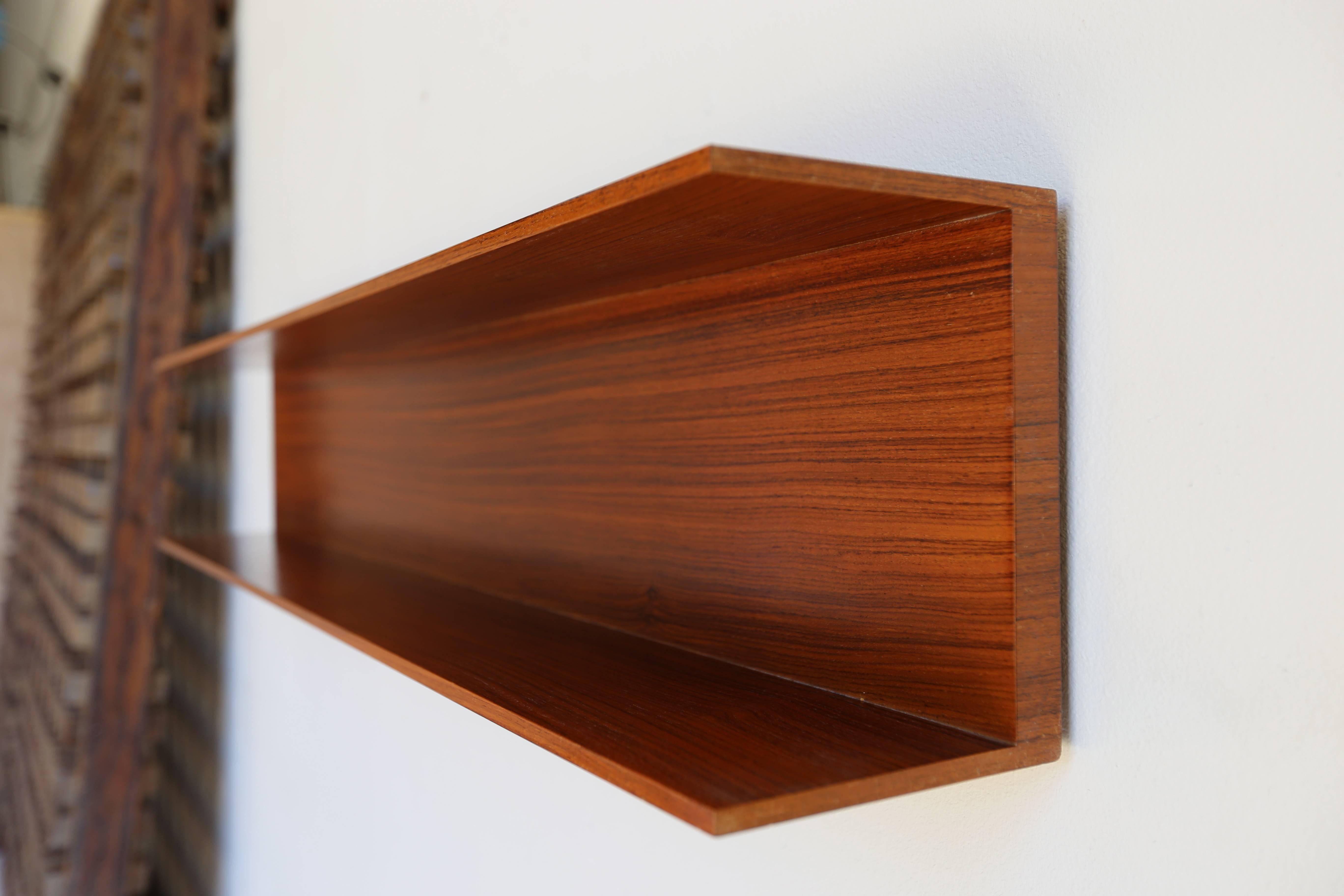 Rosewood floating and hanging shelf by Walter Wirtz for Wilhelm Renz of Germany.

MOVING SALE!!!