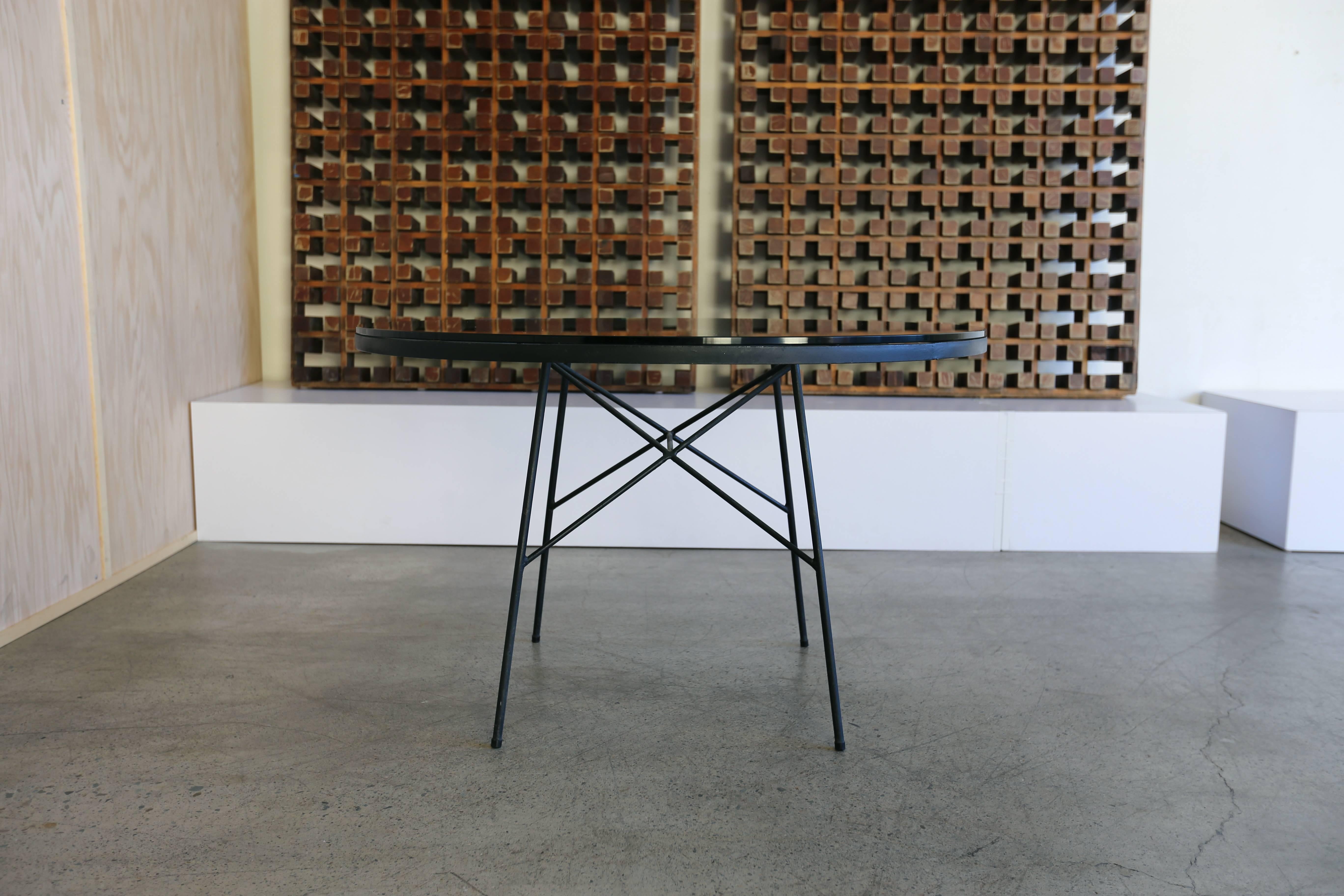 Iron and glass dining table by Paul McCobb for Arbuck.