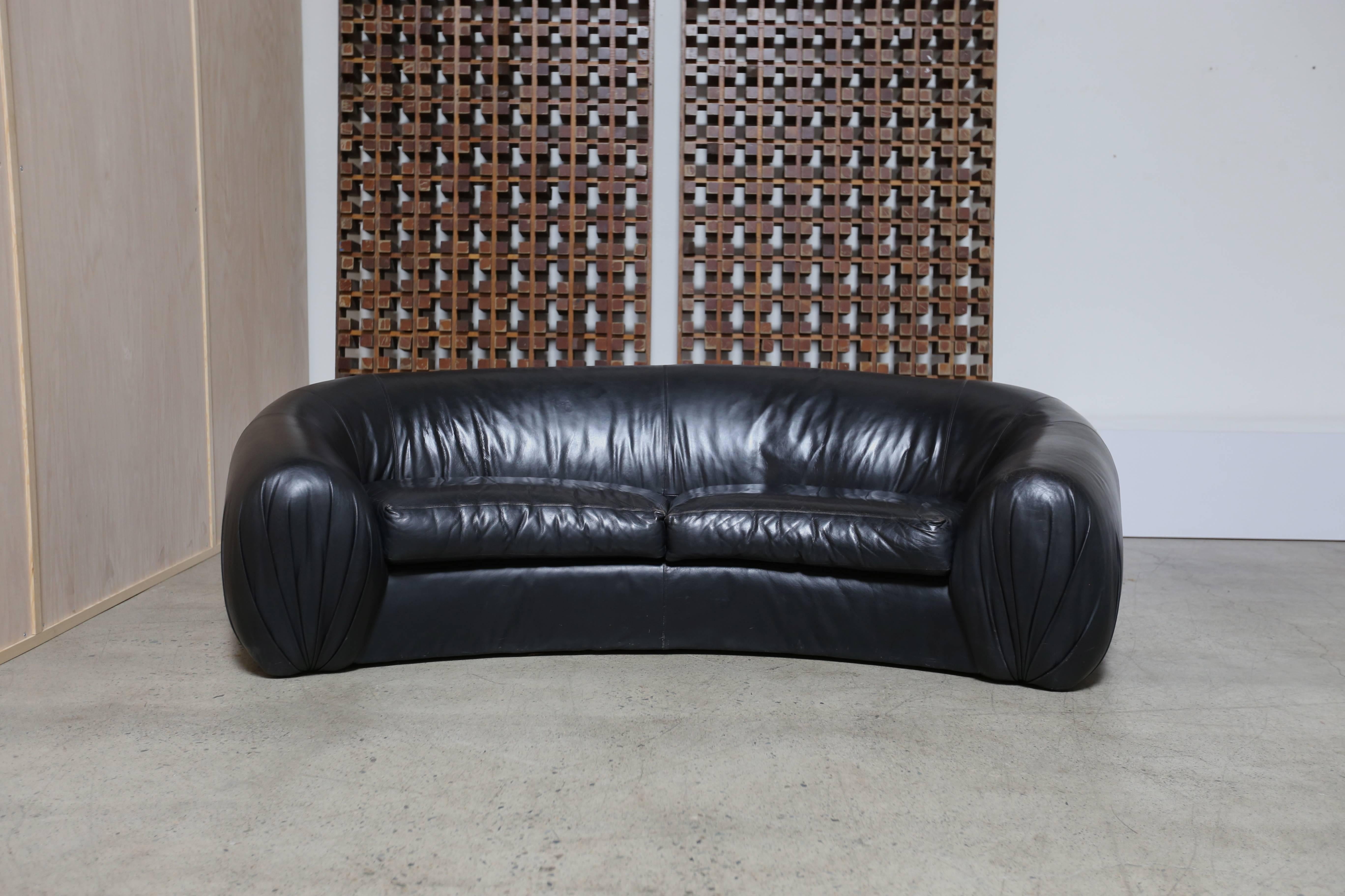 curved black leather sofa