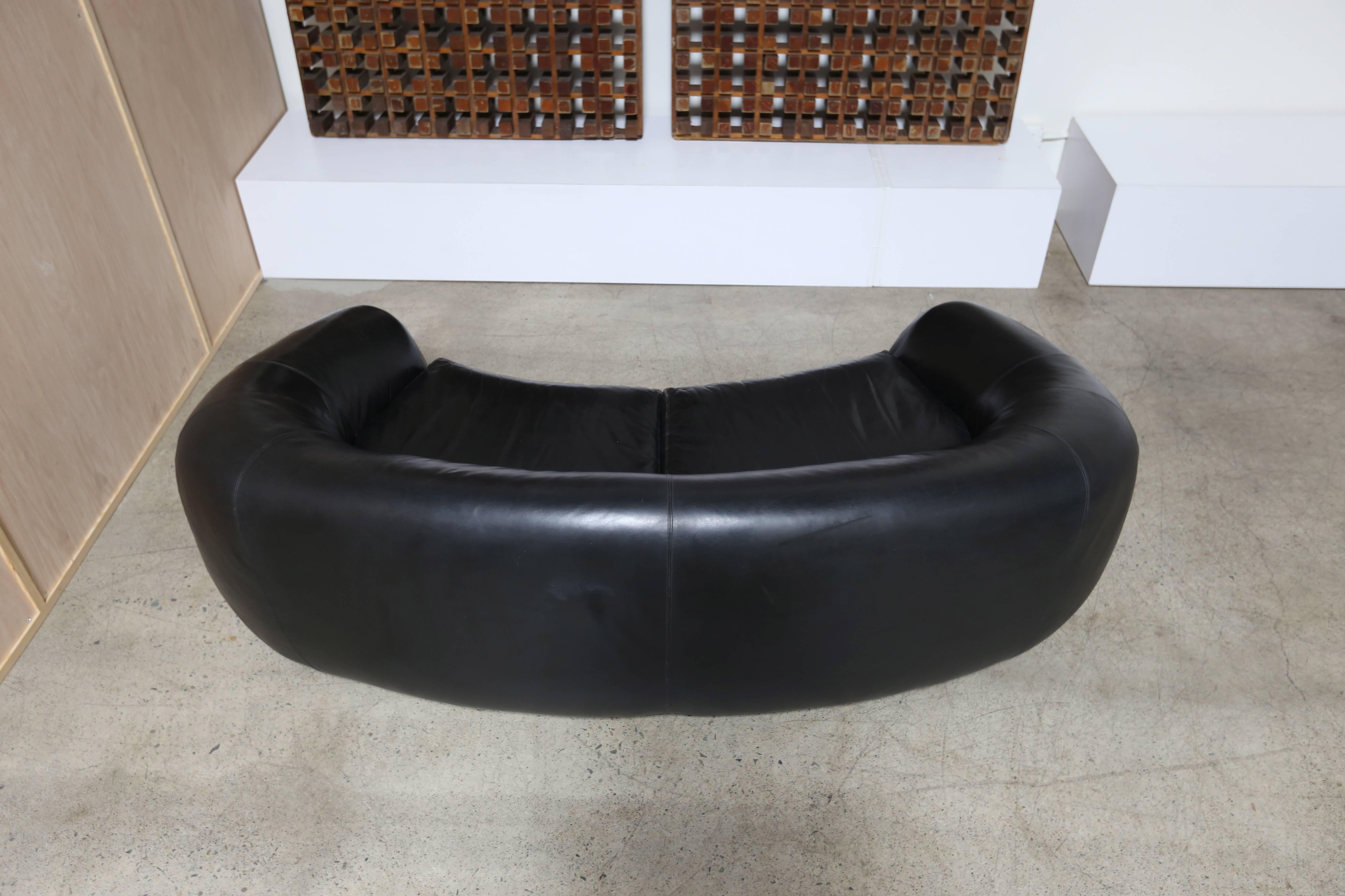black leather curved sofa