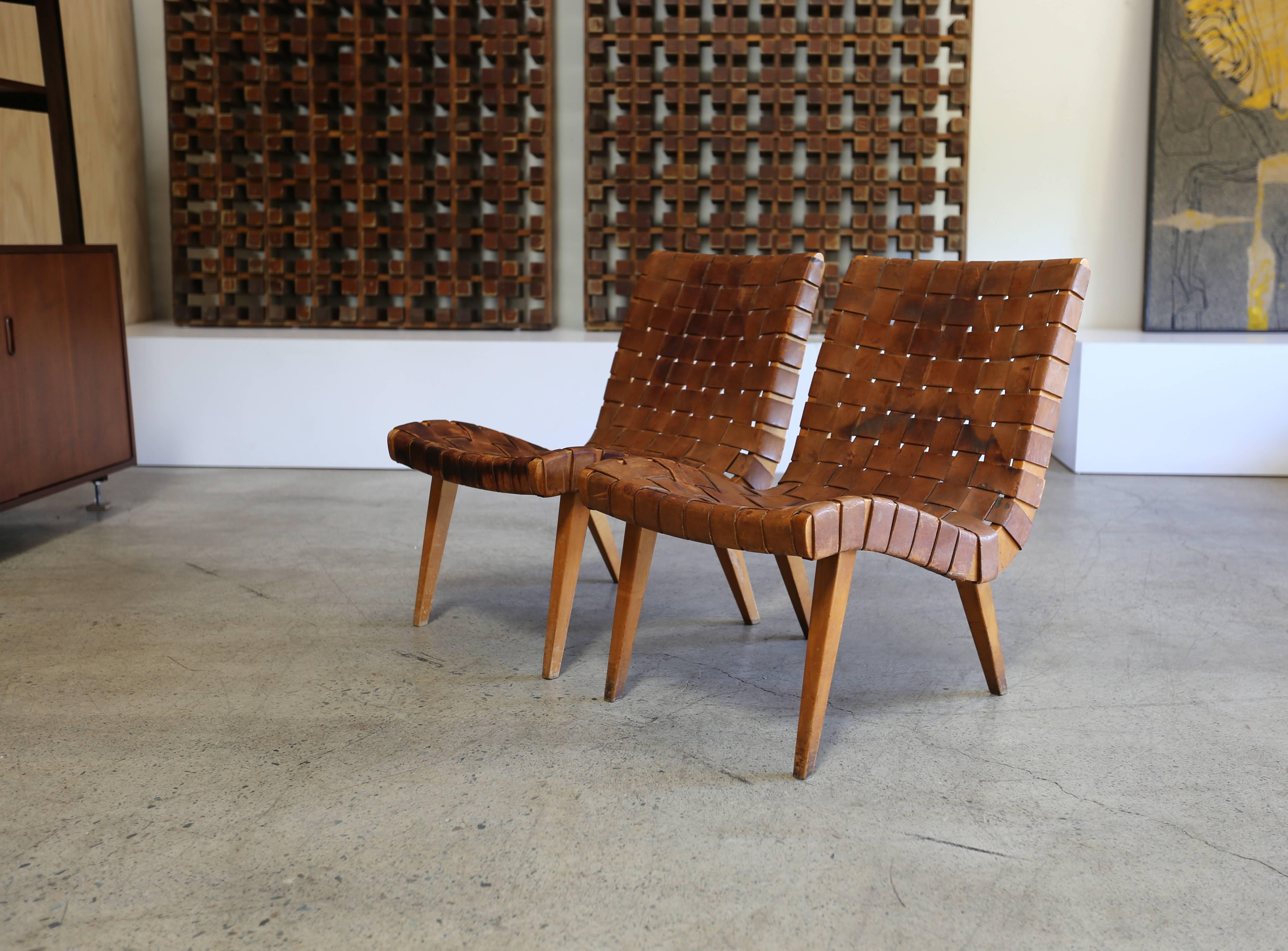 Early pair of leather strapped lounge or slipper chairs by Jens Risom for Knoll.