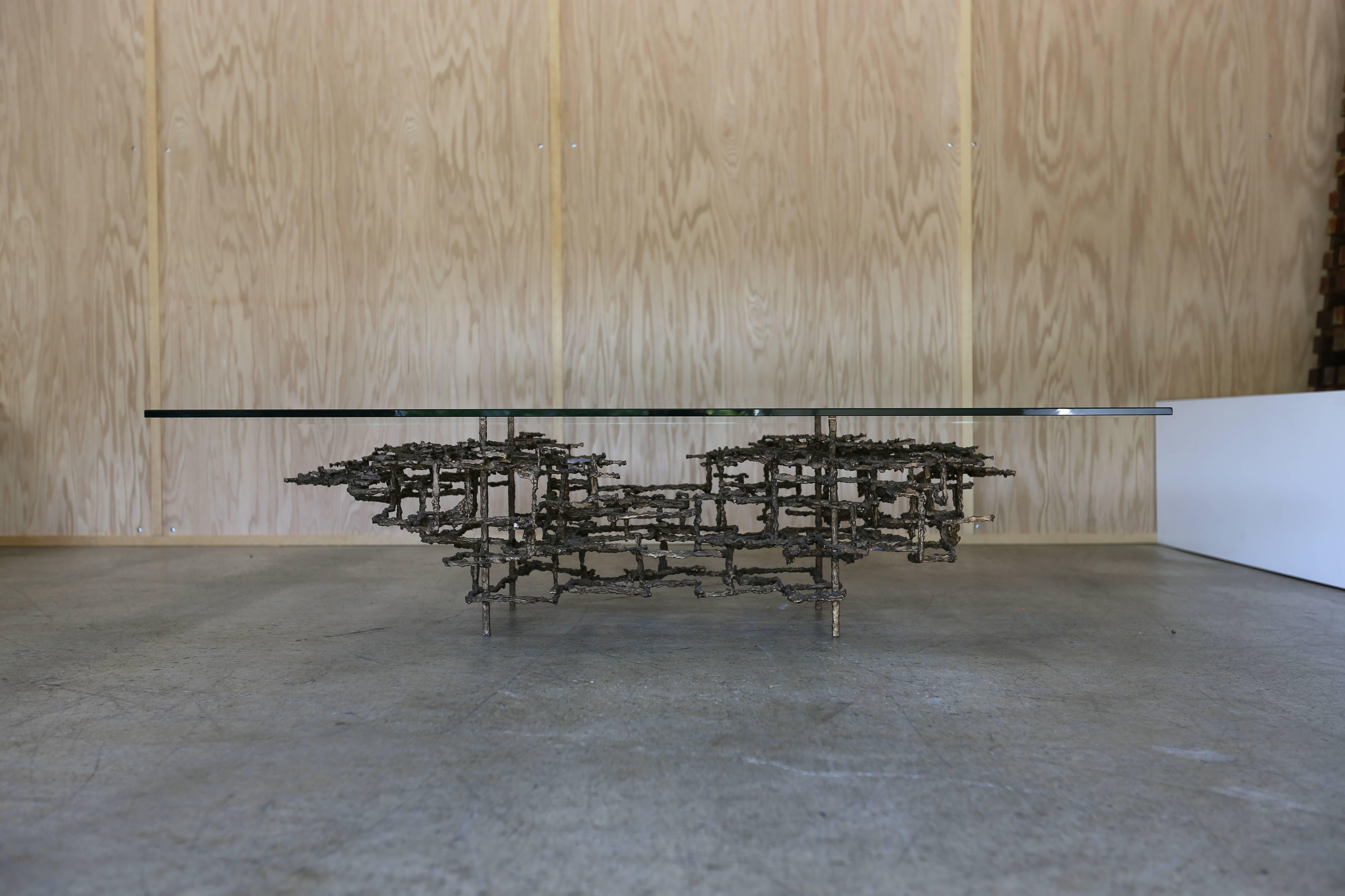 Sculptural brutalist coffee table by Daniel Gluck. This piece is signed 