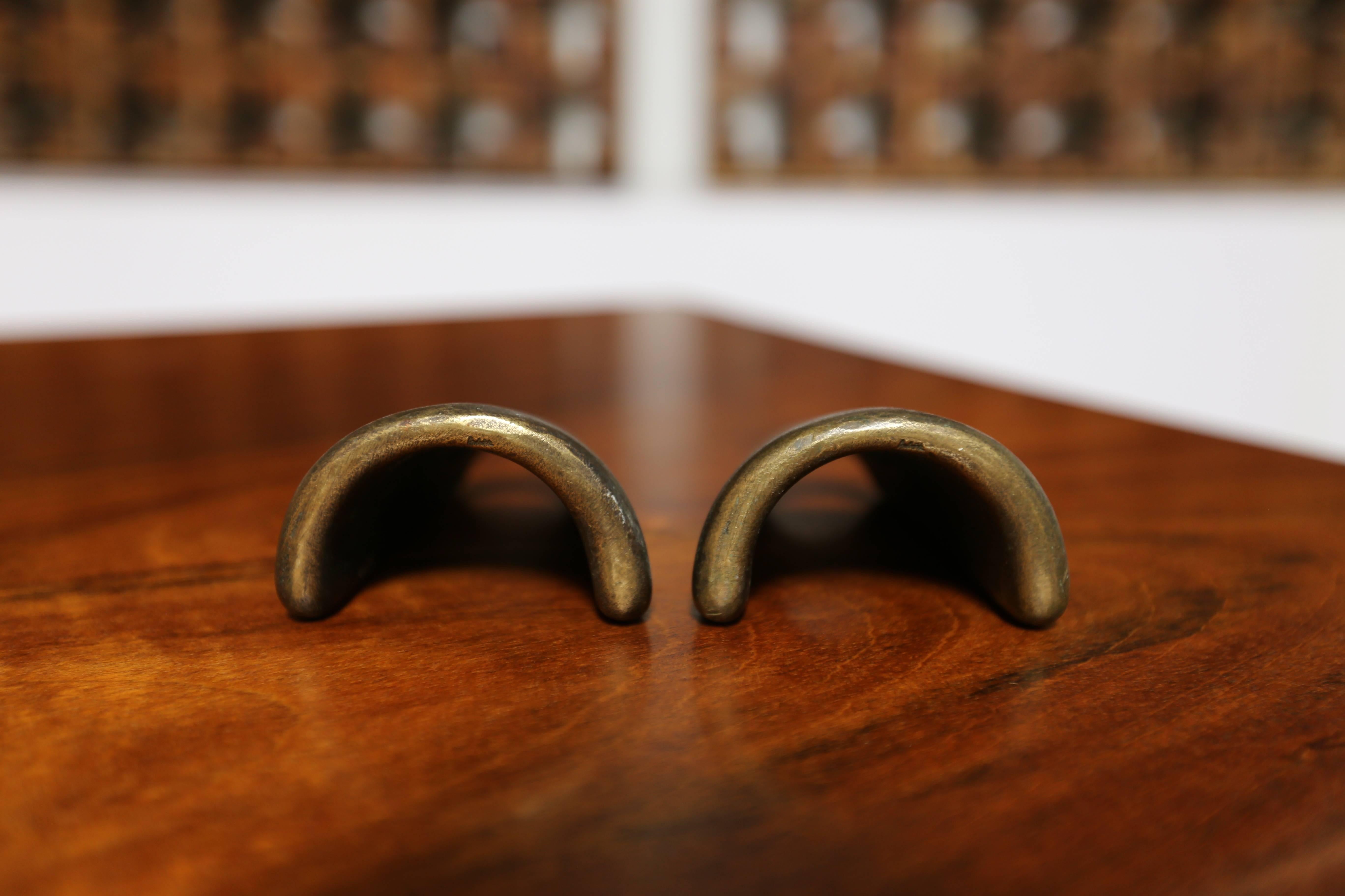 Vintage pair of bookends by Carl Auböck II.

Signed with impressed manufacturer's mark to underside of each example: [Auböck made in Austria].