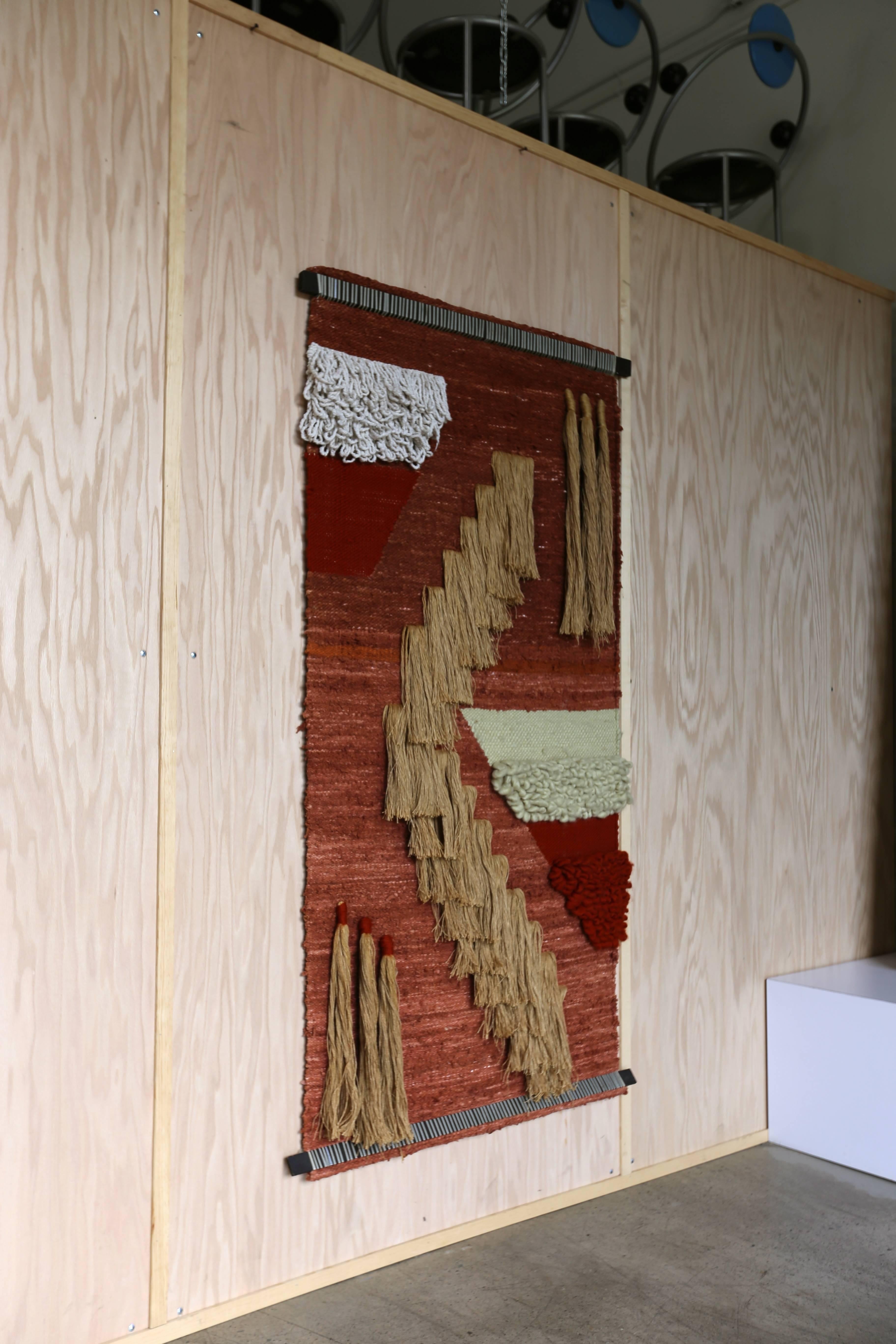 Large-scale wall hanging fiber art or textile.