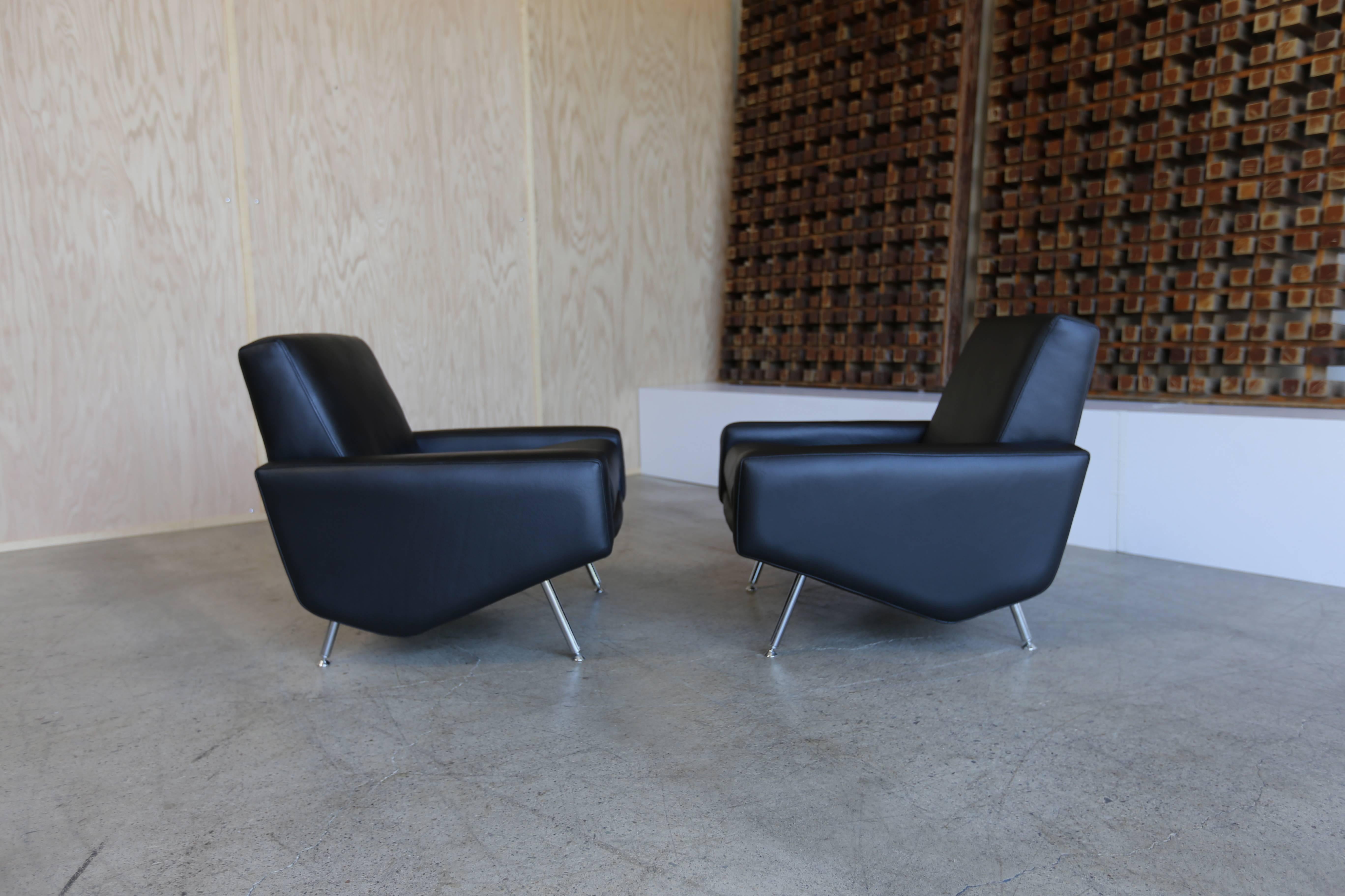 Pair of leather lounge chairs by Airborne France.