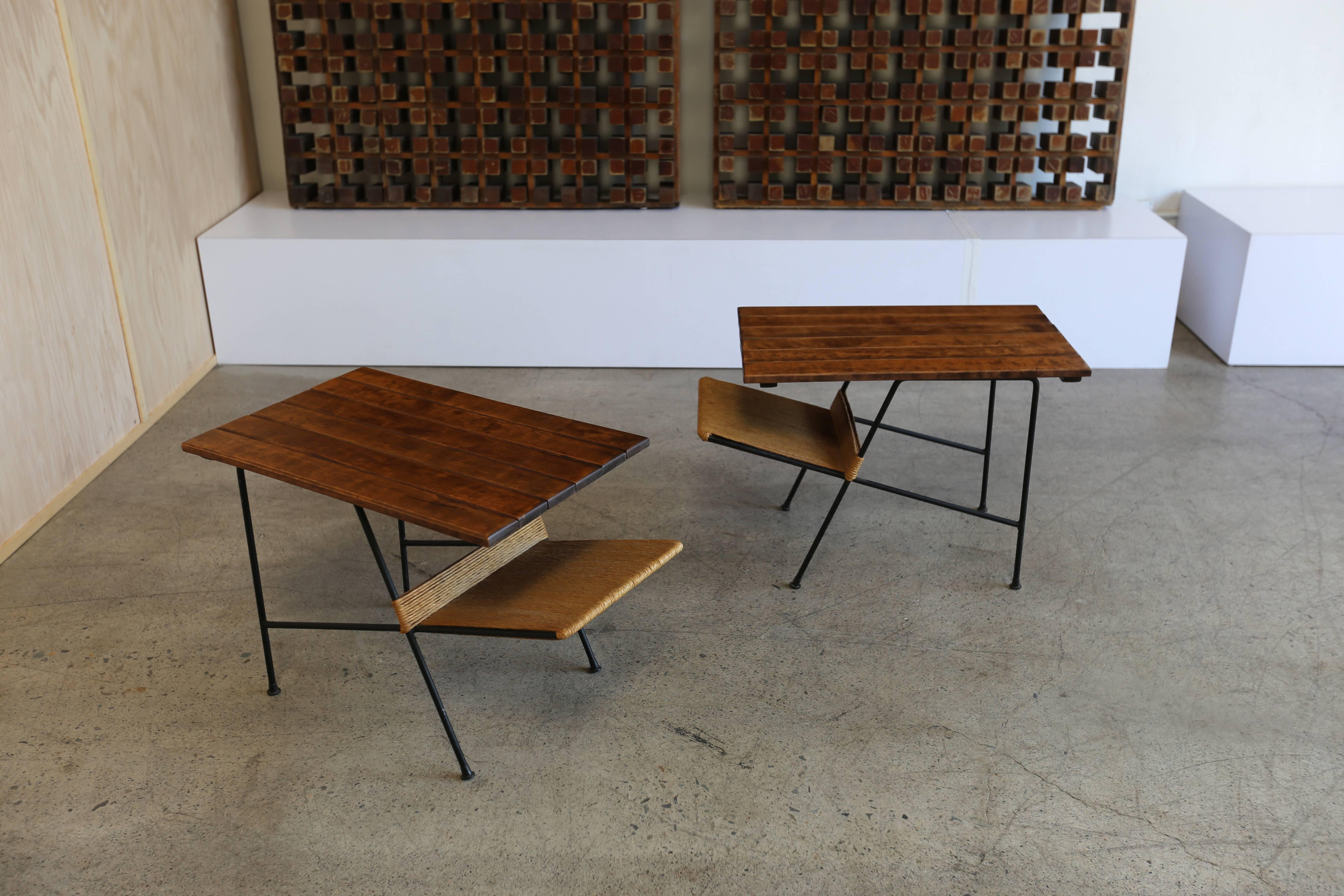 Pair of side tables by Arthur Umanoff. Papercord and iron with a slatted wood top.