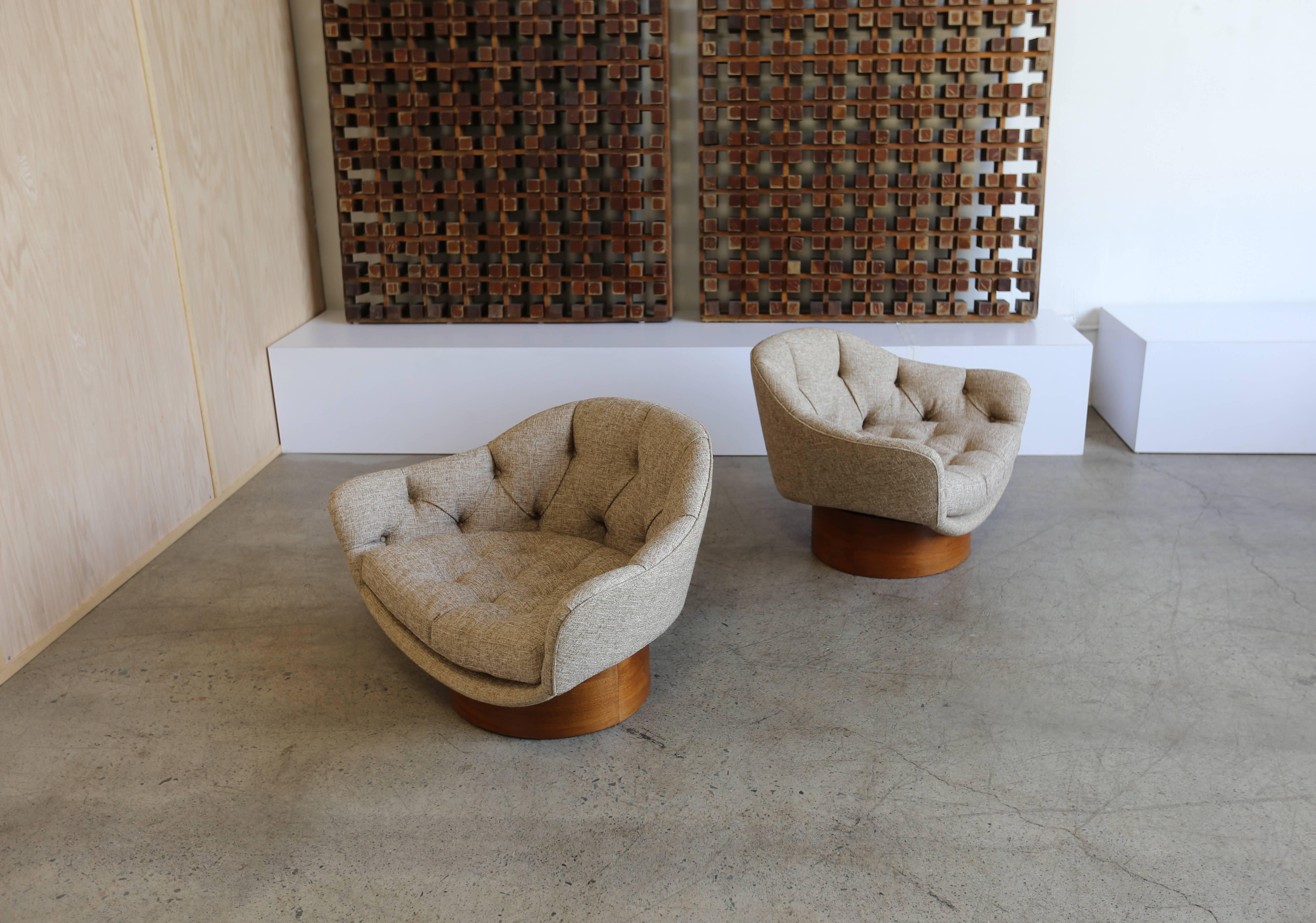 Pair of Mid-Century tufted tweed and walnut tub chairs. This pair has been professionally restored.