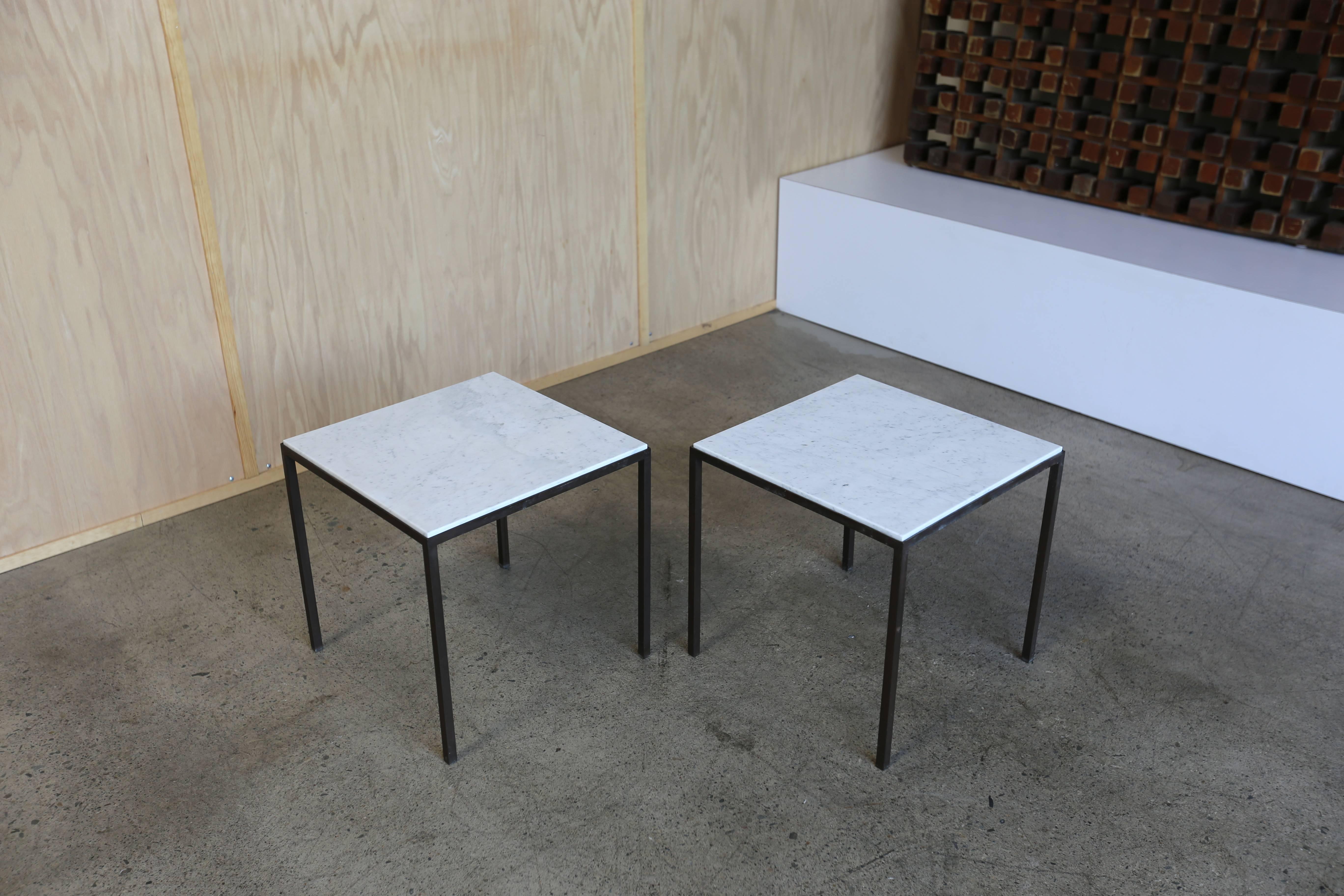 Pair of solid patinated brass and white marble side tables. Really nice original patina to the brass.