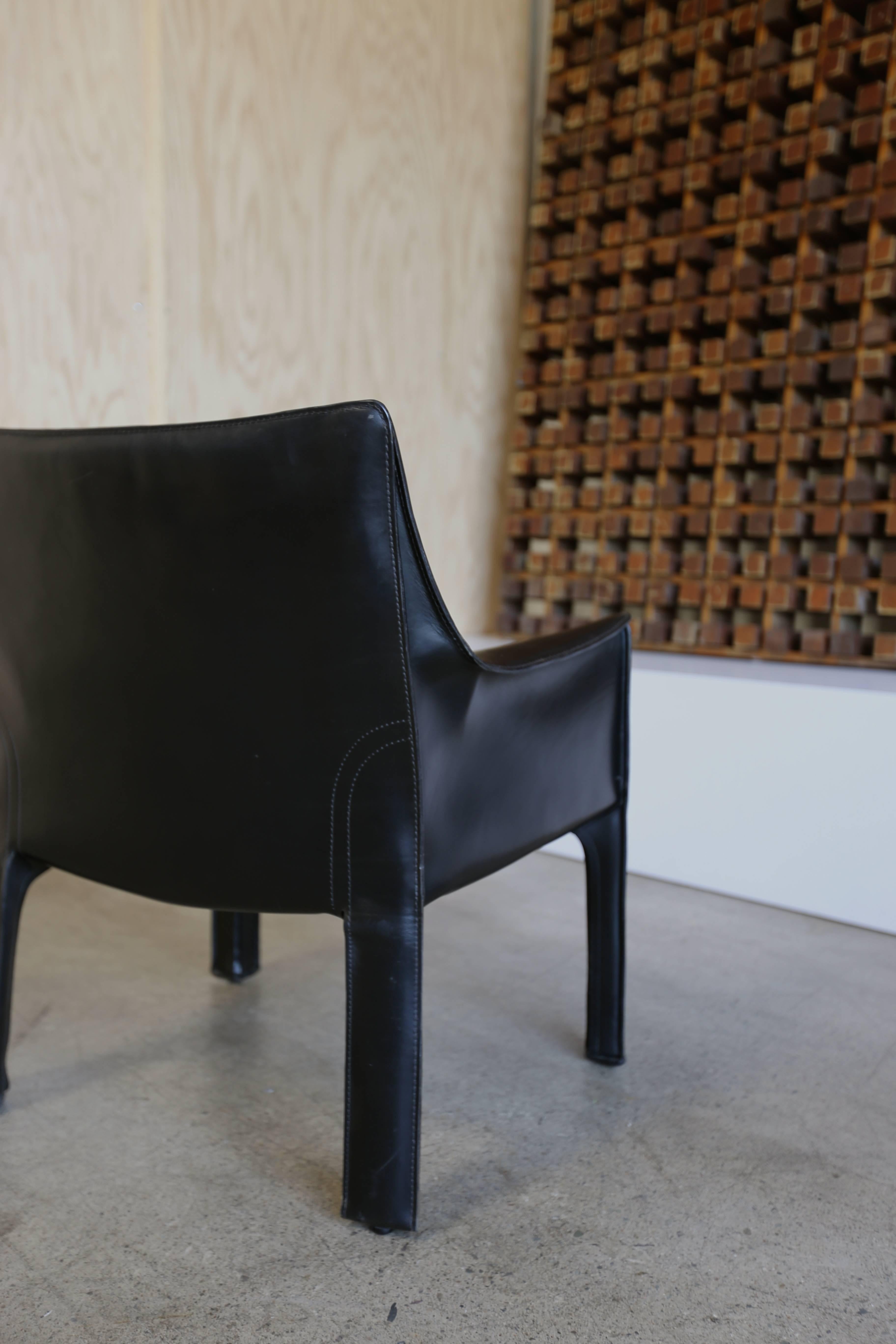 Black pair of cab leather lounge chairs by Mario Bellini for Cassina. Each chair is branded to the bottom. The listed price is for the pair.
