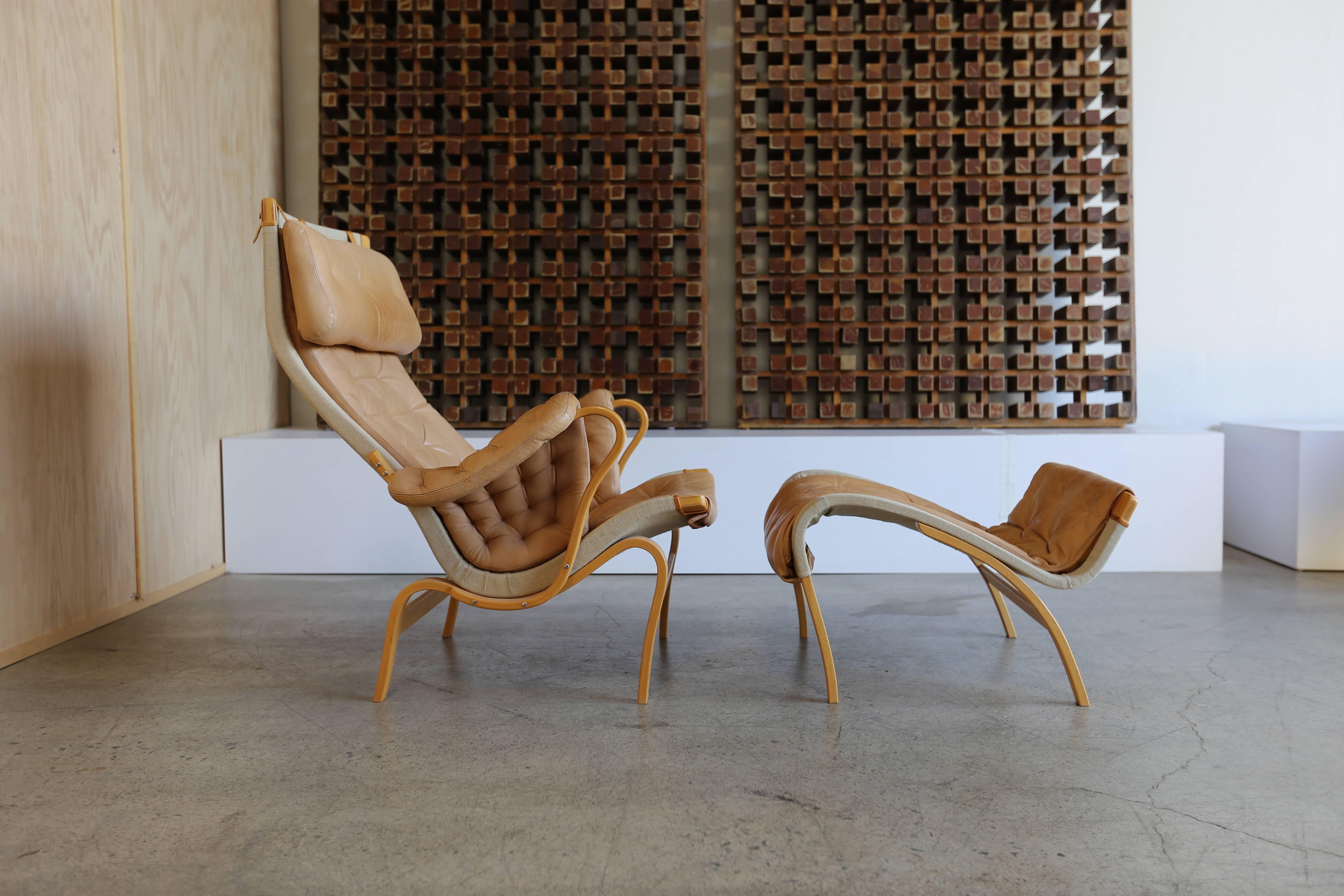 Pernilla lounge chair with ottoman by Bruno Mathsson.

The ottoman measures: 24.25 wide x 16