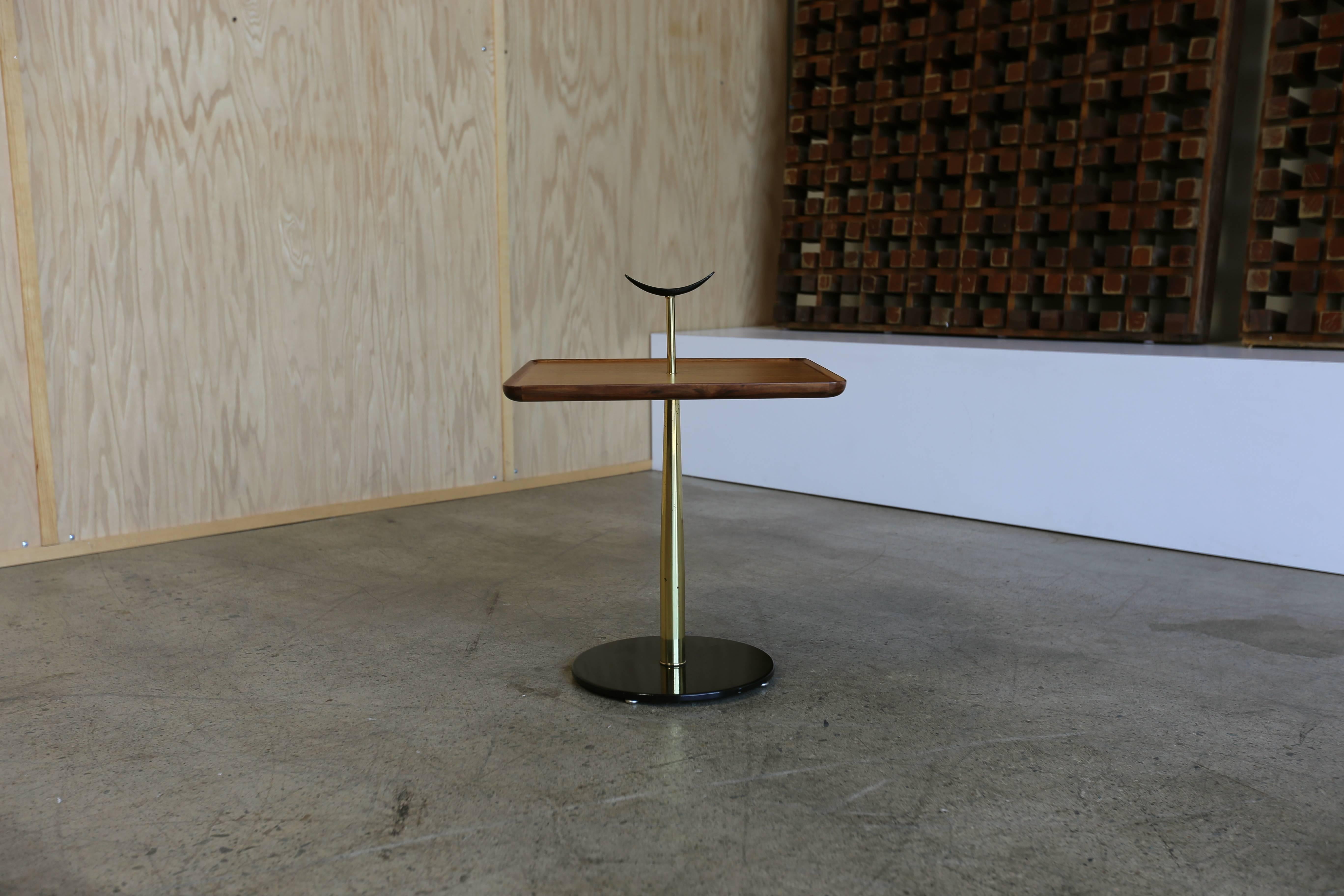 Milo Baughman for Arch Gordon side table. Solid metal crescent handle with a molded edge walnut top. Heavy brass leg and baked enamel steel base, with adjustable feet. Amazing quality on this 1956 Baughman design for the Chicago-based company.