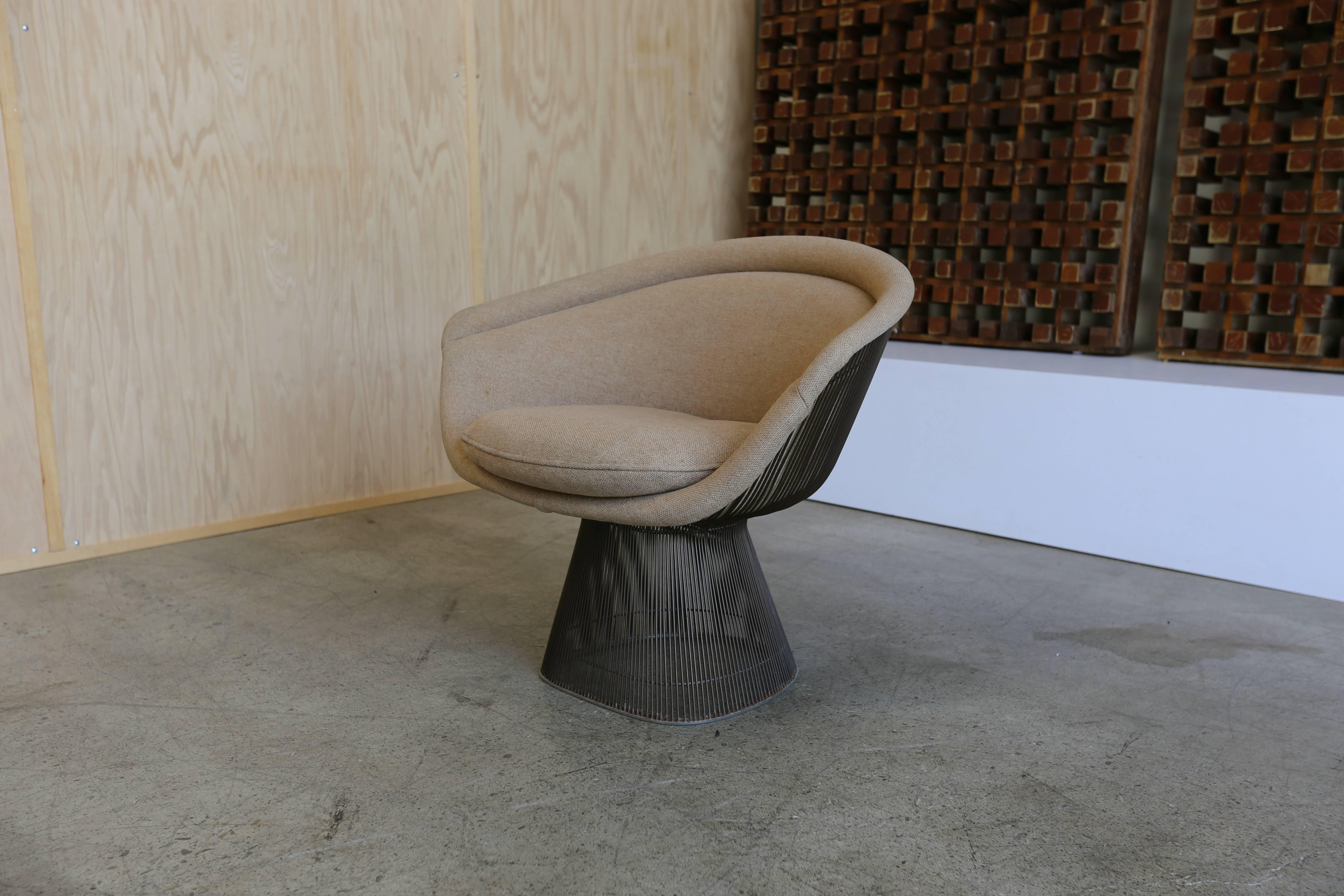 Bronze lounge chair by Warren Platner for Knoll. Bronze finished steel with a fully upholstered back.