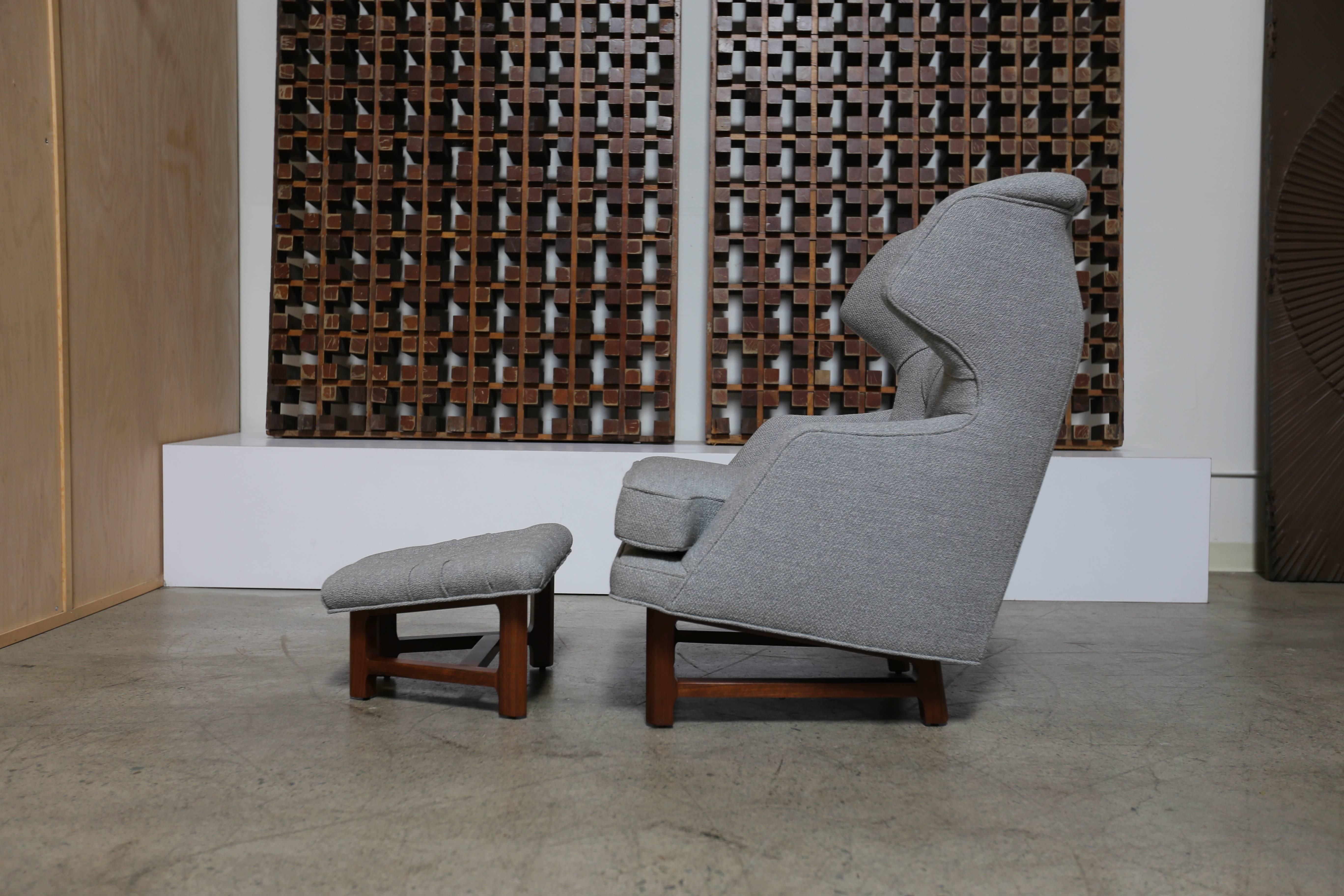 Janus wing chair and ottoman by Edward Wormley for Dunbar. This piece has been expertly restored in Pollack Berber elephant grey fabric. 

The ottoman measures: 23.5