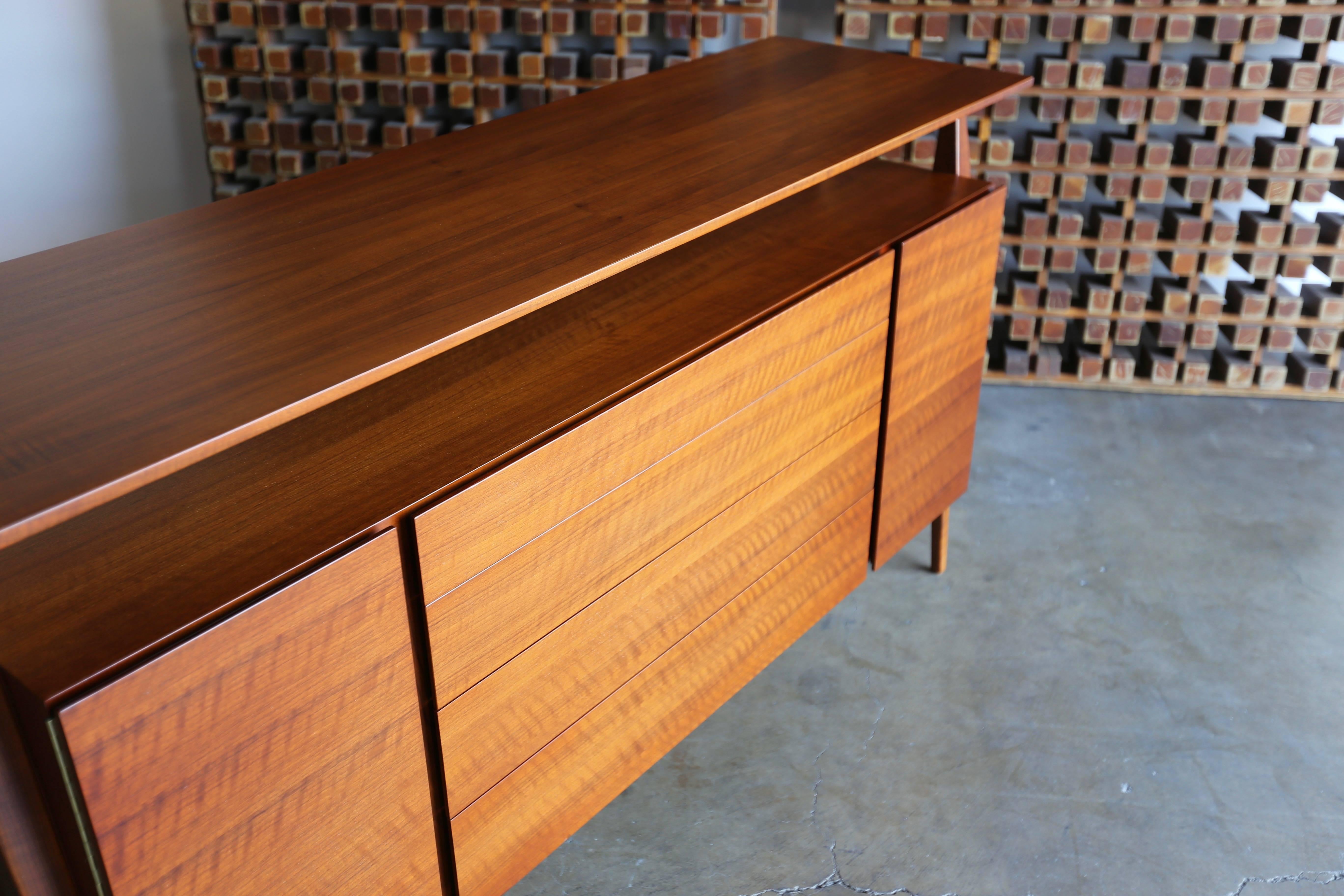 Italian walnut cabinet model 2154 by Bertha Schaefer for Singer & Sons, circa 1955. This piece has been professionally restored.