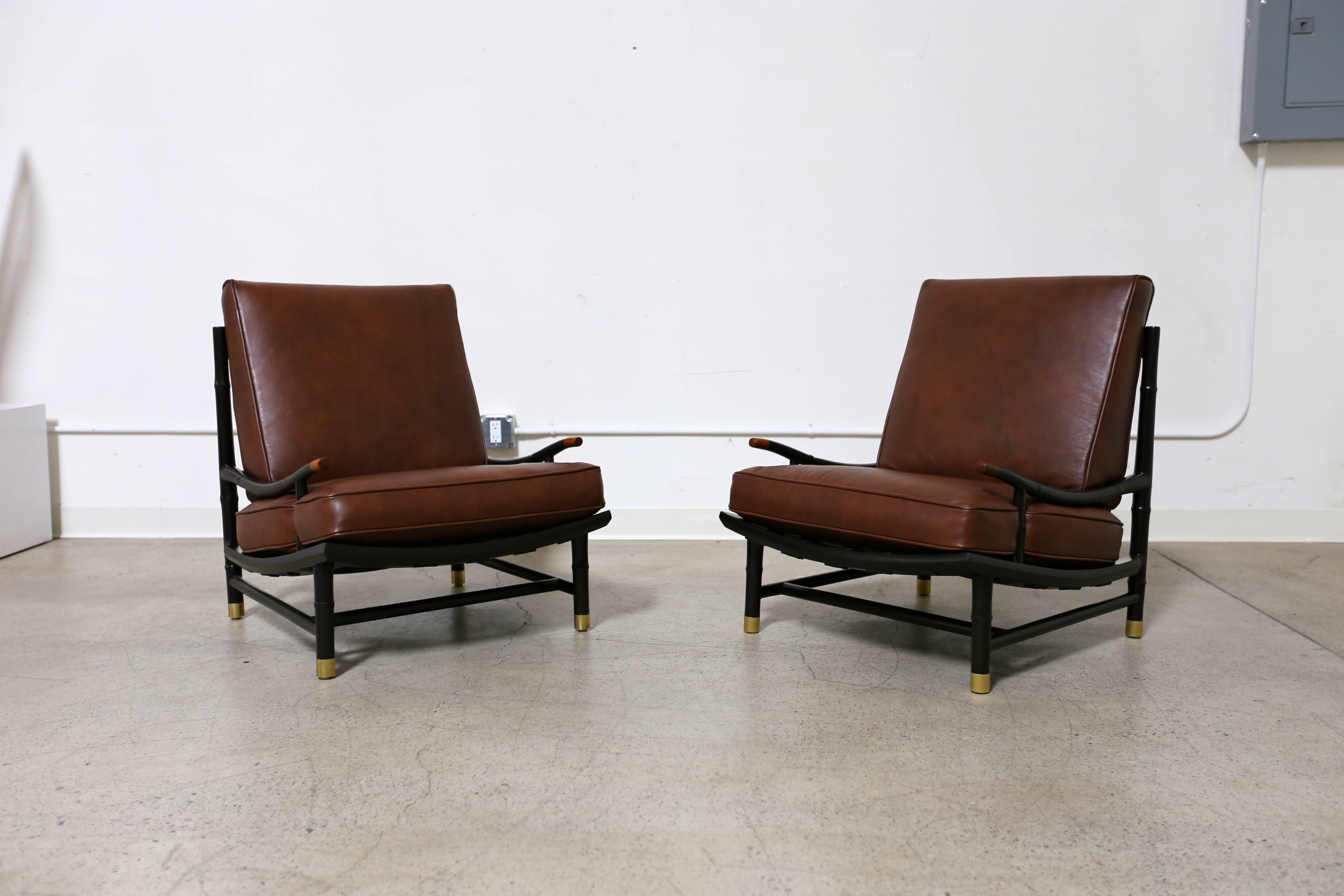 Rare lounge chairs by Frank Kyle with Maggie Howe. The lounge chairs are designed by designer Frank Kyle with enamel accents to the back by Maggie Howe. 