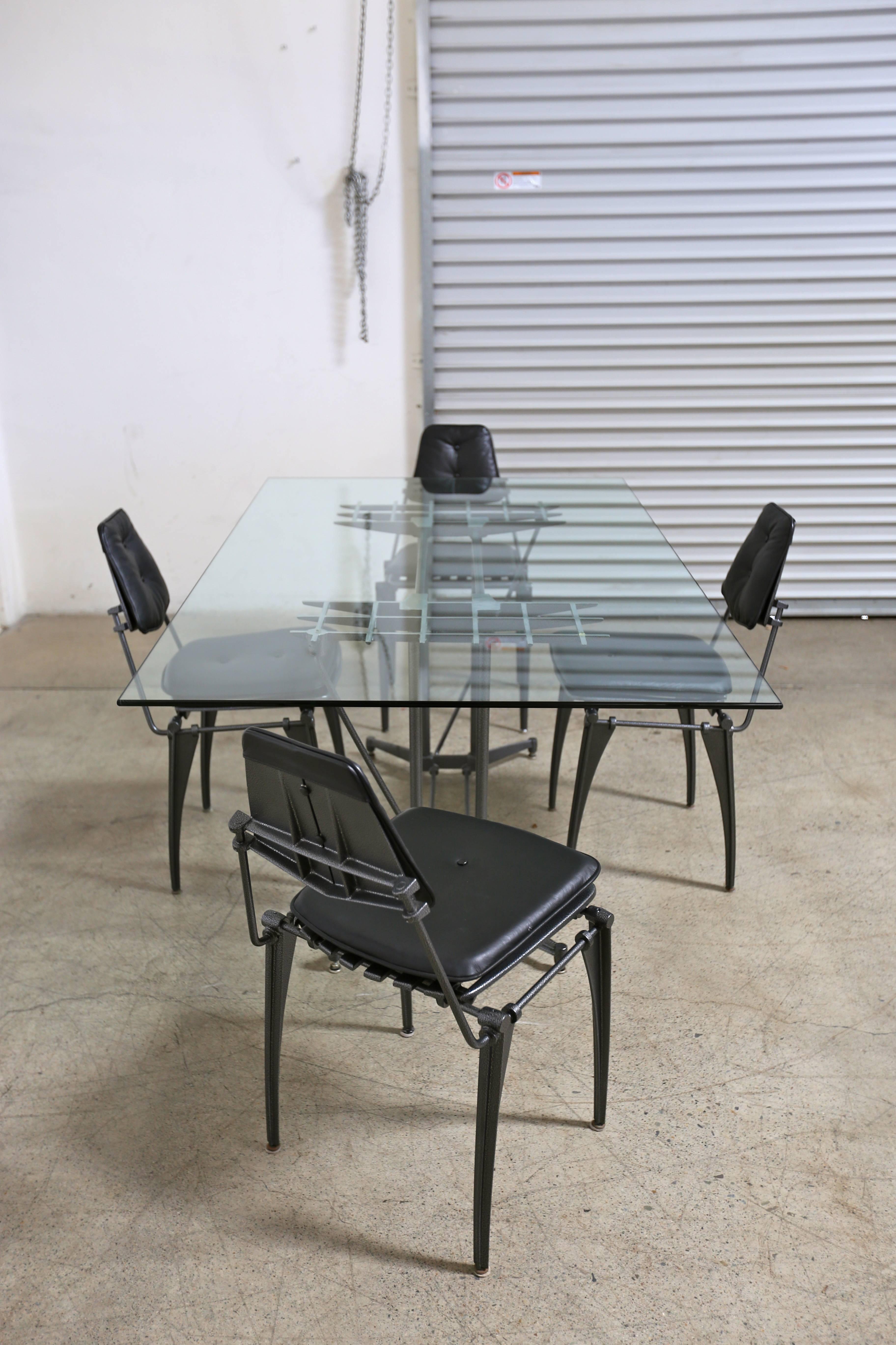 Modernist dining set by Robert Josten. 

The table measures: 71.5" wide x 41.75" deep x 29" tall.

Each chair measures: 18.5" wide x 20" deep x 34" tall 20" to the top of the seat.