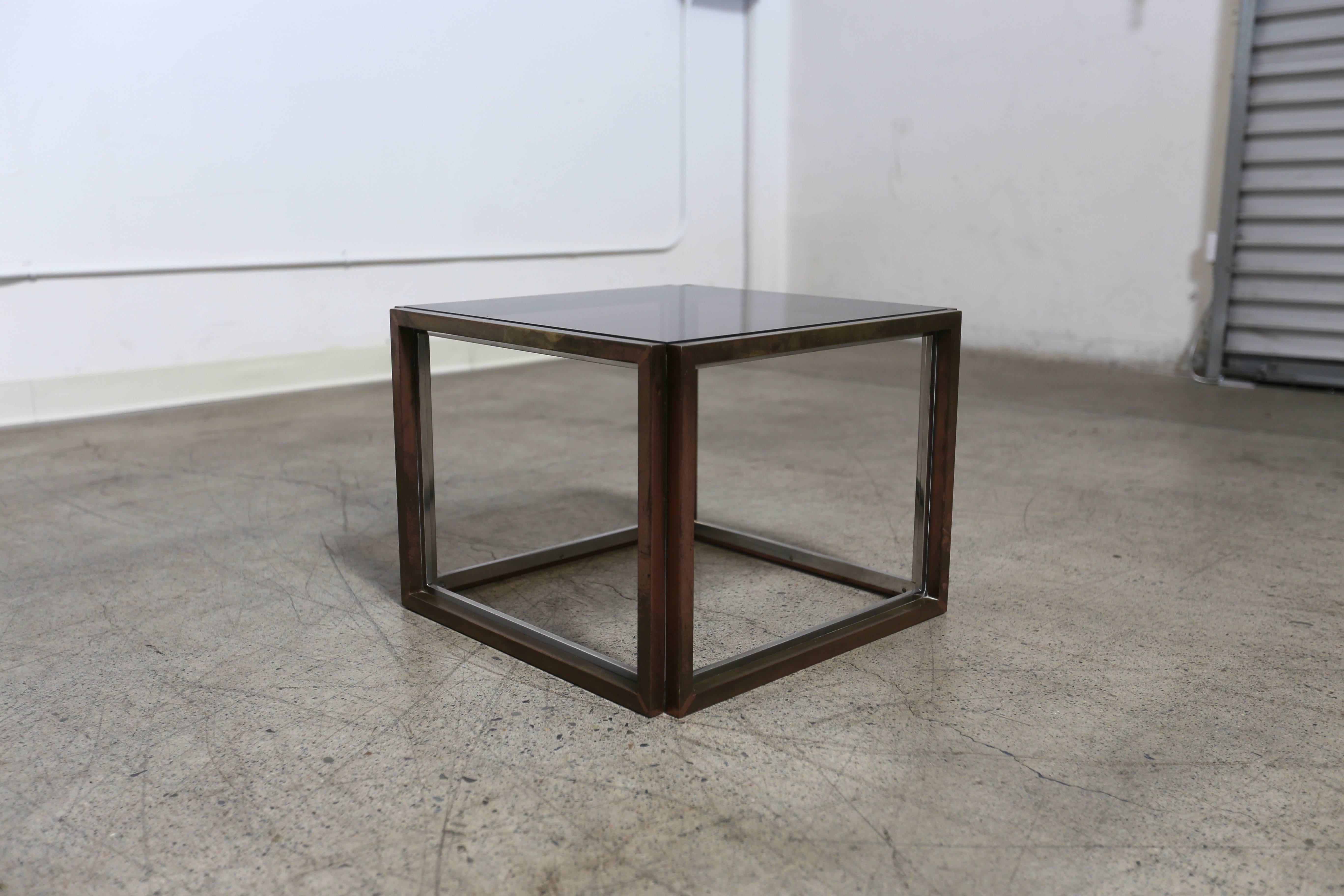 Quality stainless steel, brass and smoked glass side table by Willy Rizzo. This piece has a great original patina to the brass.