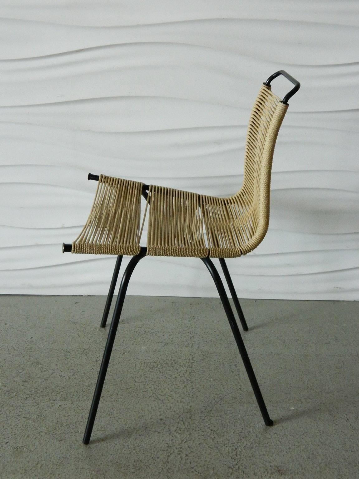 Designed in 1956, this Paul Kjaerholm PK-1 chair has its original roping and painted metal finish.