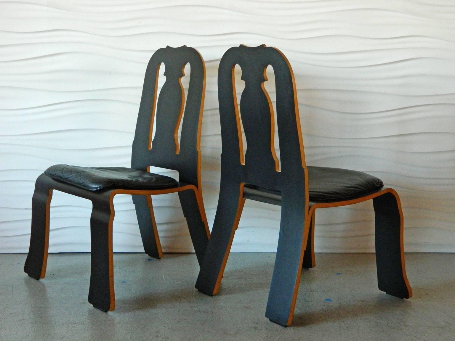 The Queen Anne chairs were designed by American architect Robert Venturi for Knoll. This pair was manufactured in 1986 and has black leather seat cushions.